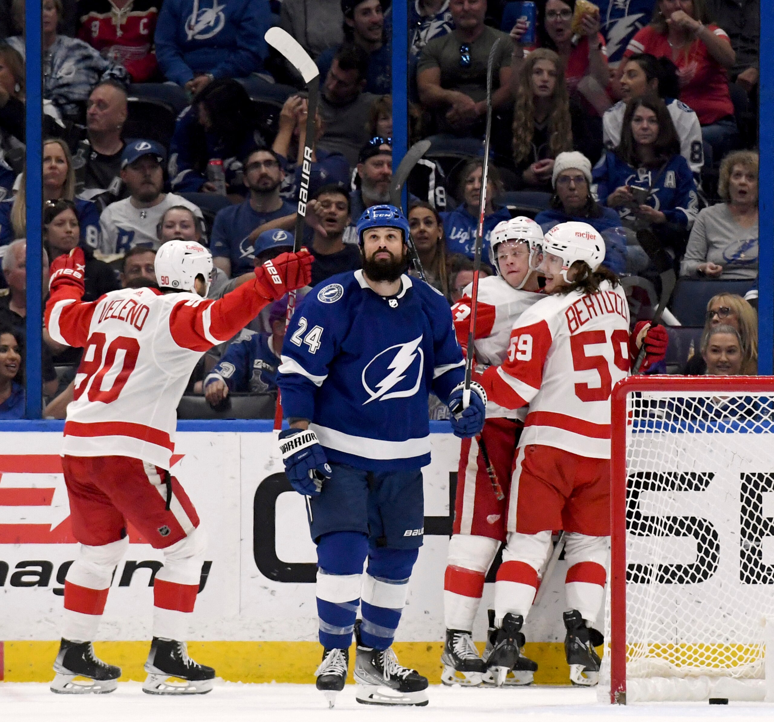 Tampa Bay Lightning defenseman Zach Bogosian (24) looks away as the Detroit Red Wings celebrate left wing Lucas Raymond's goal (23) during the third period an NHL hockey game Tuesday, April 19, 2022, in Tampa, Fla. (AP Photo/Jason Behnken)