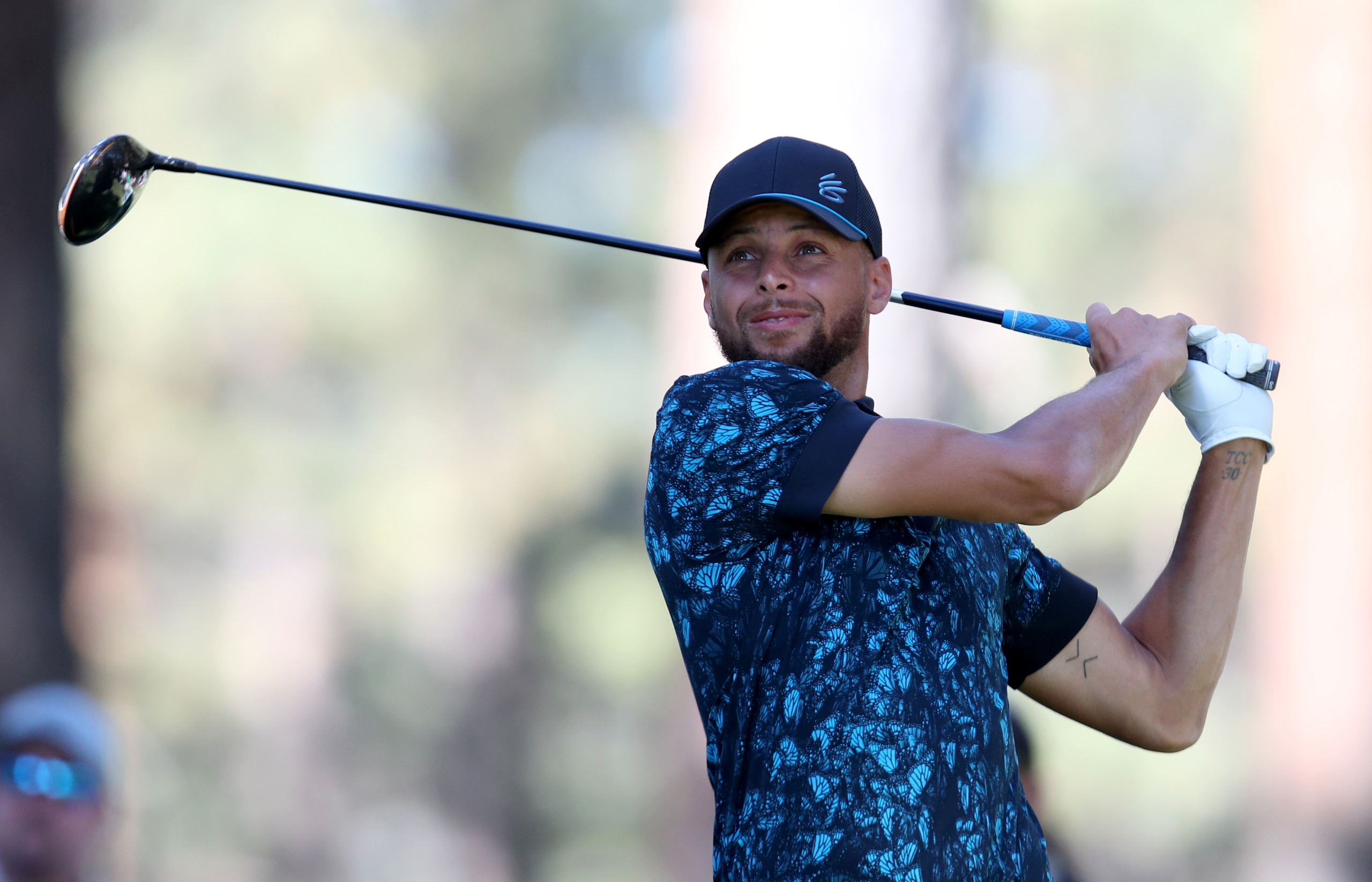 SOUTH LAKE TAHOE, NEVADA - JULY 11: NBA athlete Steph Curry tees off from the second hole during the final round of the American Century Championship at Edgewood Tahoe South golf course on July 11, 2020 in South Lake Tahoe, Nevada.  (Photo by Jed Jacobsohn/Getty Images)