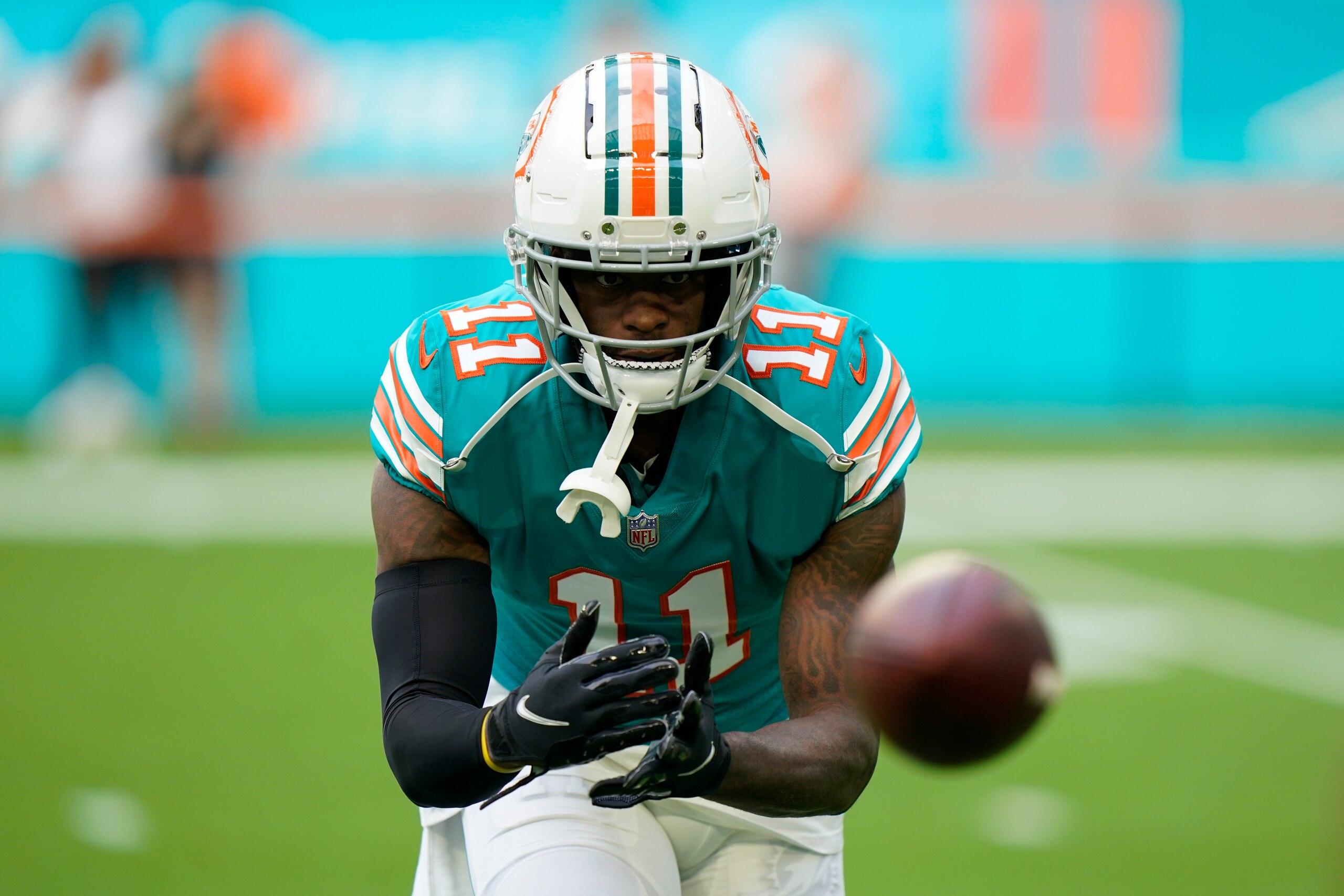 Miami Dolphins wide receiver DeVante Parker (11) makes a catch during warm-ups ahead of an NFL football game against the New England Patriots, Sunday, Jan. 9, 2022, in Miami Gardens, Fla. (AP Photo/Willfredo Lee)