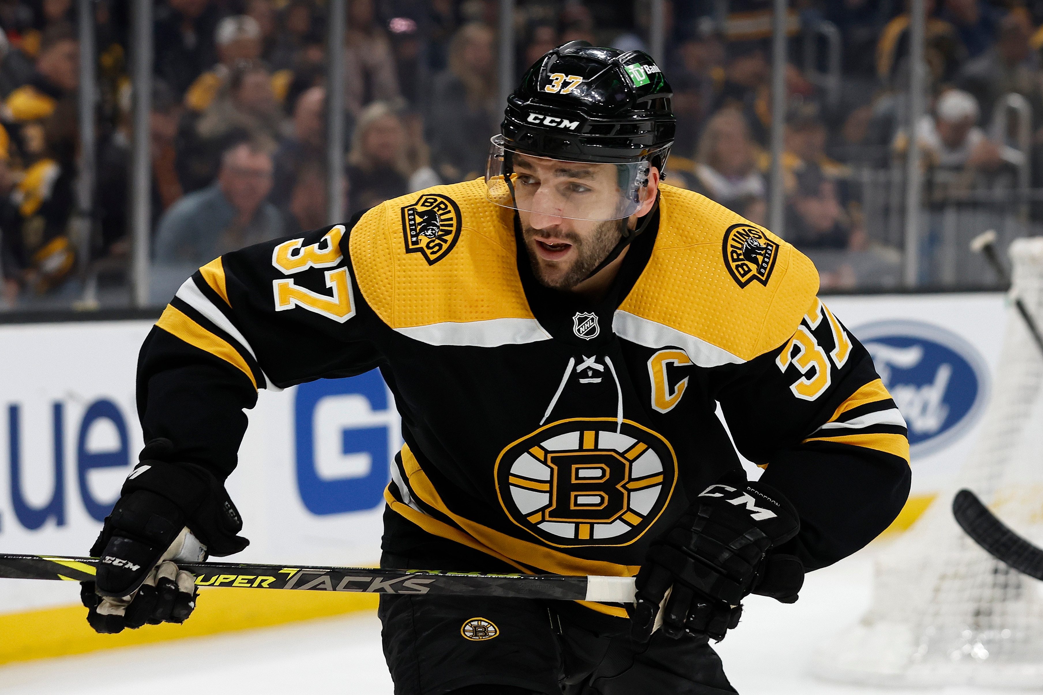 Boston Bruins' Patrice Bergeron during the first period of an NHL hockey game against the Pittsburgh Penguins Saturday, April 16, 2022, in Boston. (AP Photo/Winslow Townson)