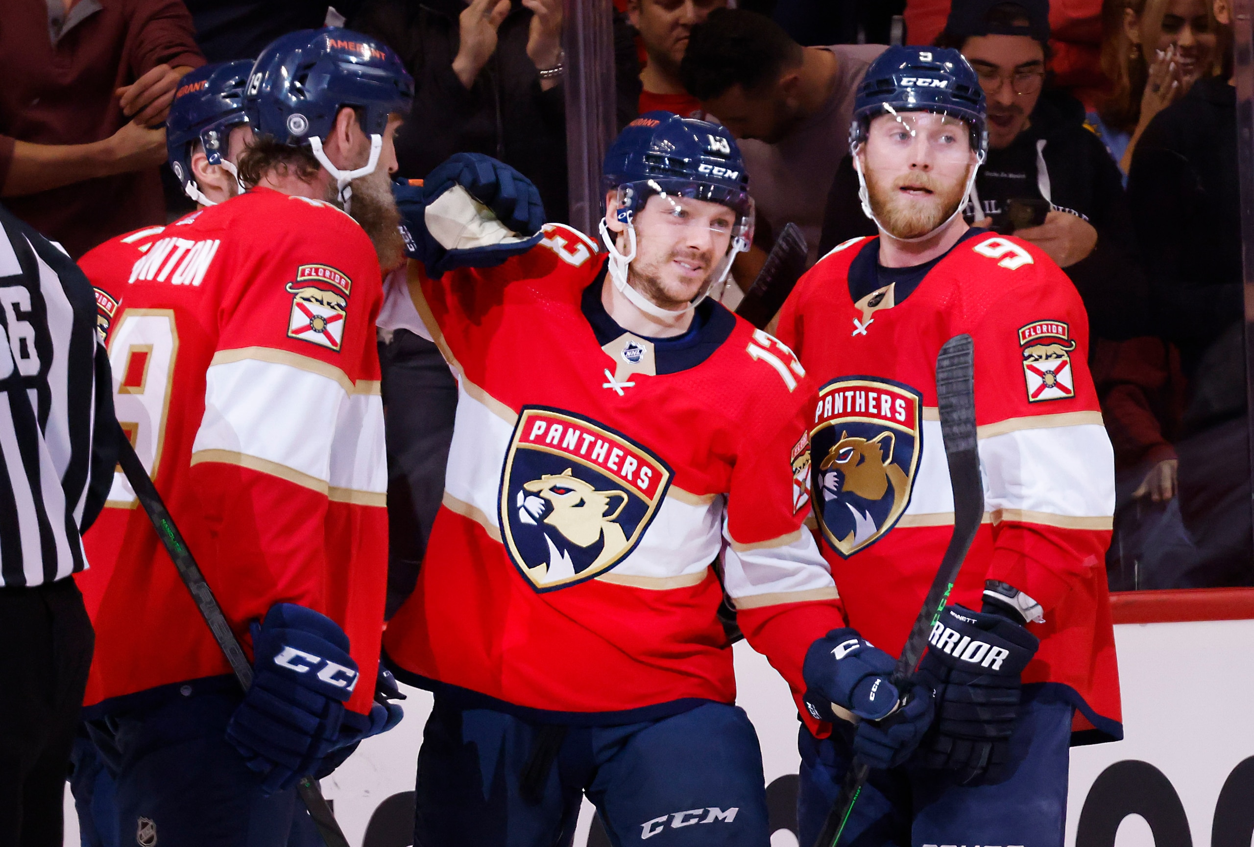 Florida Panthers center Joe Thornton (19) and center Sam Bennett (9) congratulate center Sam Reinhart (13) on his goal during the third period of an NHL hockey game against the Detroit Red Wings, Thursday, April 21, 2022, in Sunrise, Fla. (AP Photo/Reinhold Matay)