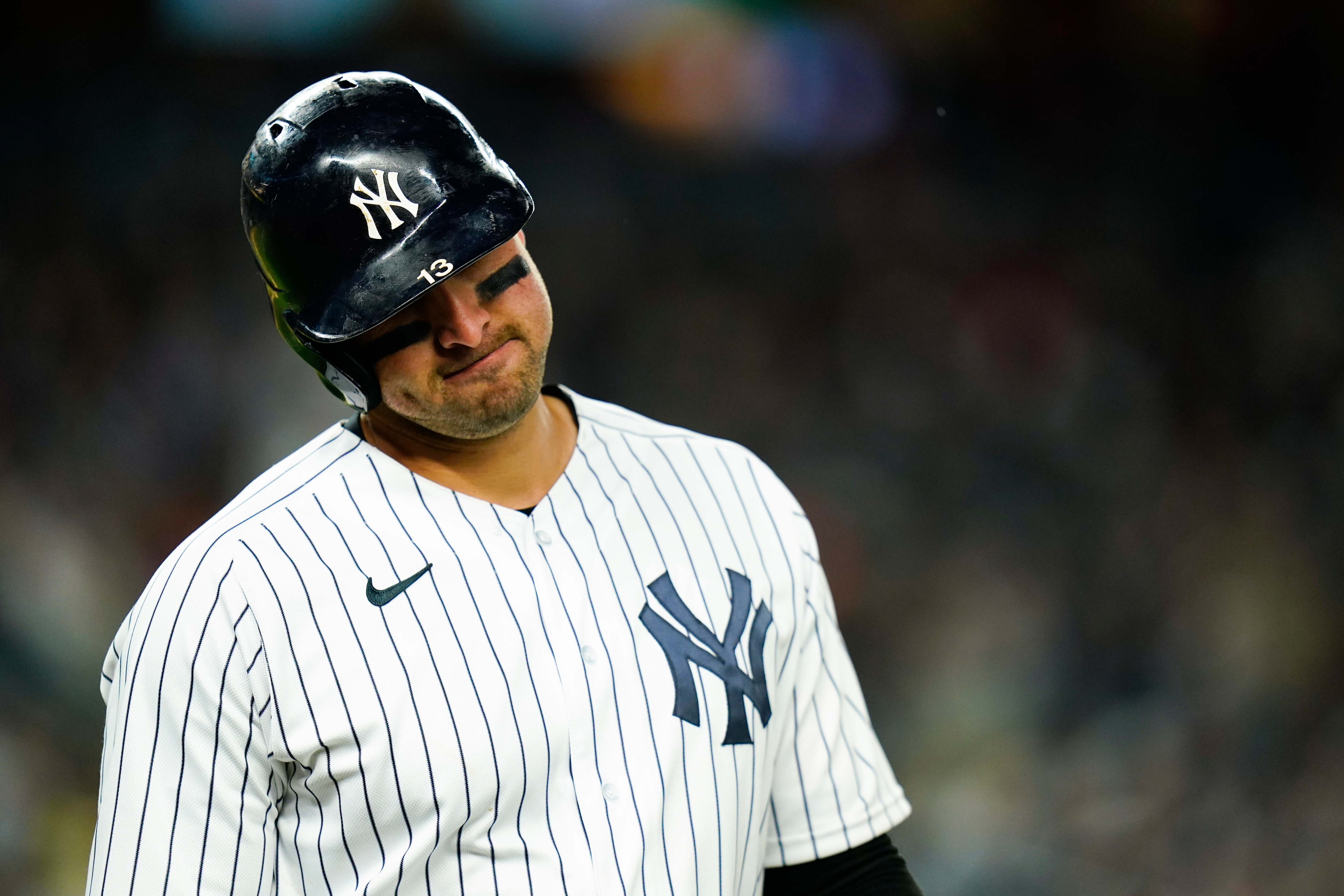 New York Yankees' Joey Gallo reacts after hitting a fly out during the fifth inning of a baseball game against the Boston Red Sox Sunday, April 10, 2022, in New York. (AP Photo/Frank Franklin II)