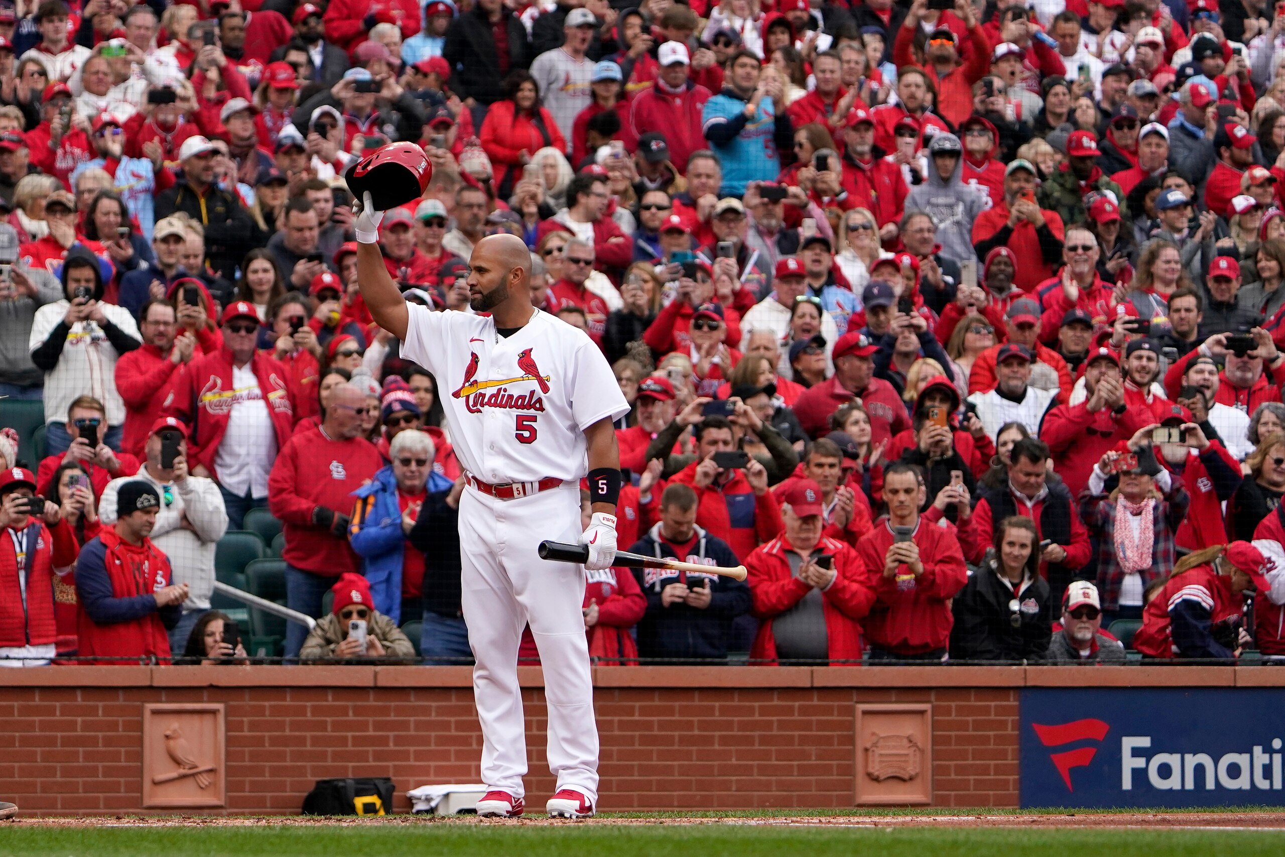 St. Louis Cardinals designated hitter Albert Pujols tips his cap as he steps up to bat during the first inning of a baseball game against the Pittsburgh Pirates Thursday, April 7, 2022, in St. Louis. (AP Photo/Jeff Roberson) St. Louis Cardinals designated hitter Albert Pujols tips his cap as he steps up to bat during the first inning of a baseball game against the Pittsburgh Pirates Thursday, April 7, 2022, in St. Louis. (AP Photo/Jeff Roberson)