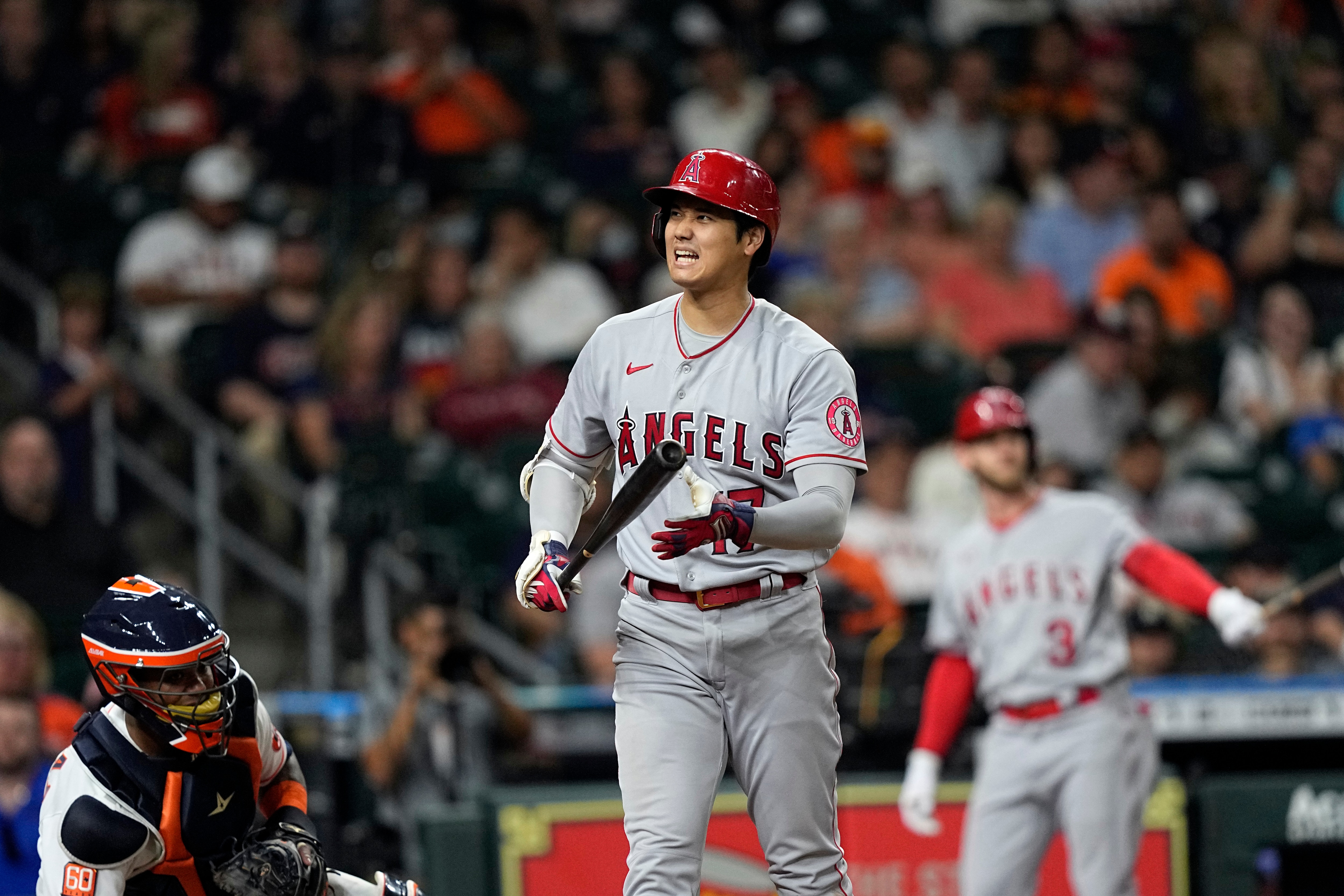 Los Angeles Angels' Shohei Ohtani reacts after a swinging strike during the sixth inning of a baseball game against the Houston Astros Tuesday, April 19, 2022, in Houston. (AP Photo/David J. Phillip)