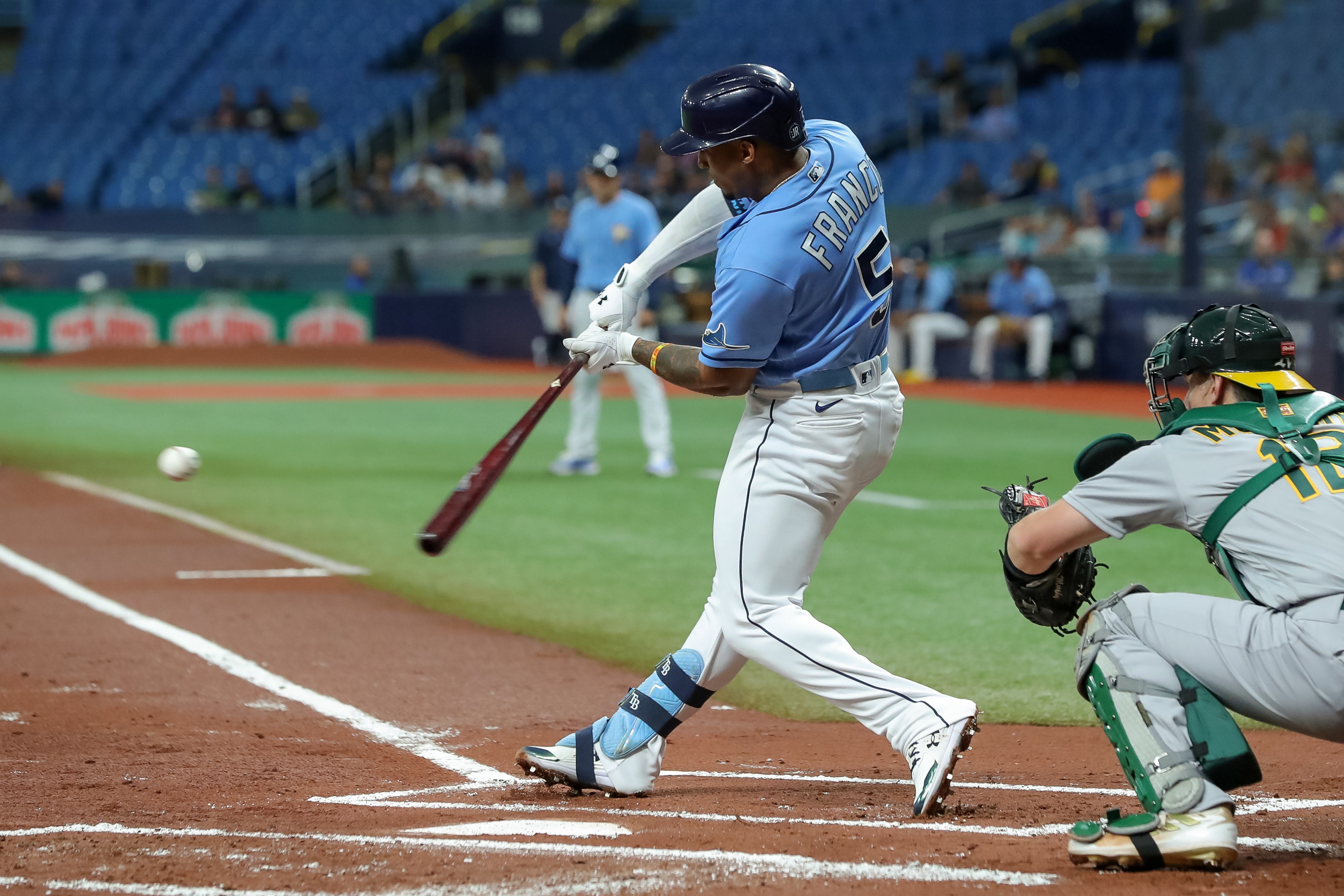 ST. PETERSBURG, FL - APRIL 13: Wander Franco #5 of the Tampa Bay Rays bats against the Oakland Athletics in the first inning of a baseball game at Tropicana Field on April 13, 2022 in St. Petersburg, Florida. (Photo by Mike Carlson/Getty Images)