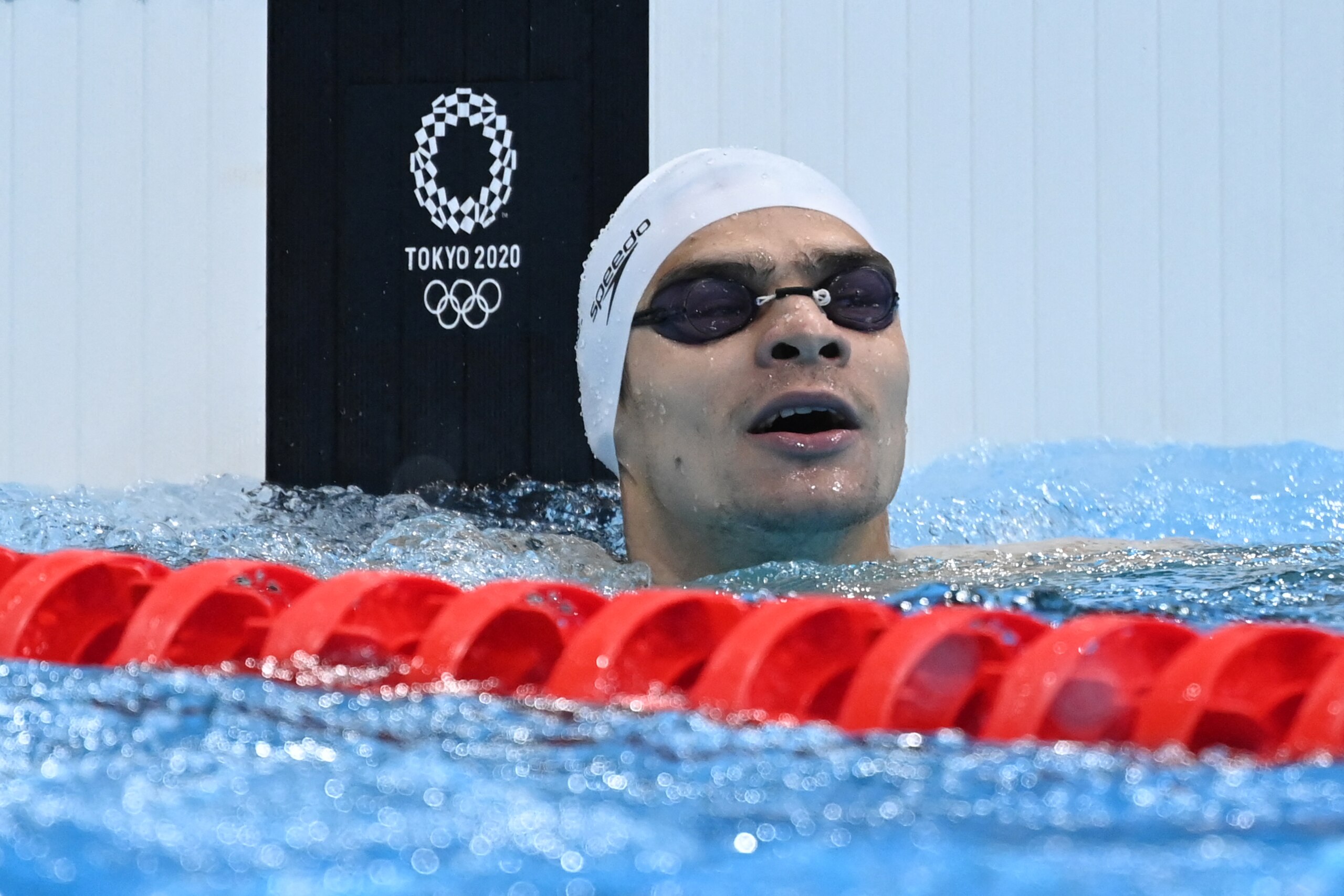 Russia's Evgeny Rylov reacts after winning the final of the men's 200m backstroke swimming event during the Tokyo 2020 Olympic Games at the Tokyo Aquatics Centre in Tokyo on July 30, 2021. (Photo by Jonathan NACKSTRAND / AFP) (Photo by JONATHAN NACKSTRAND/AFP via Getty Images)