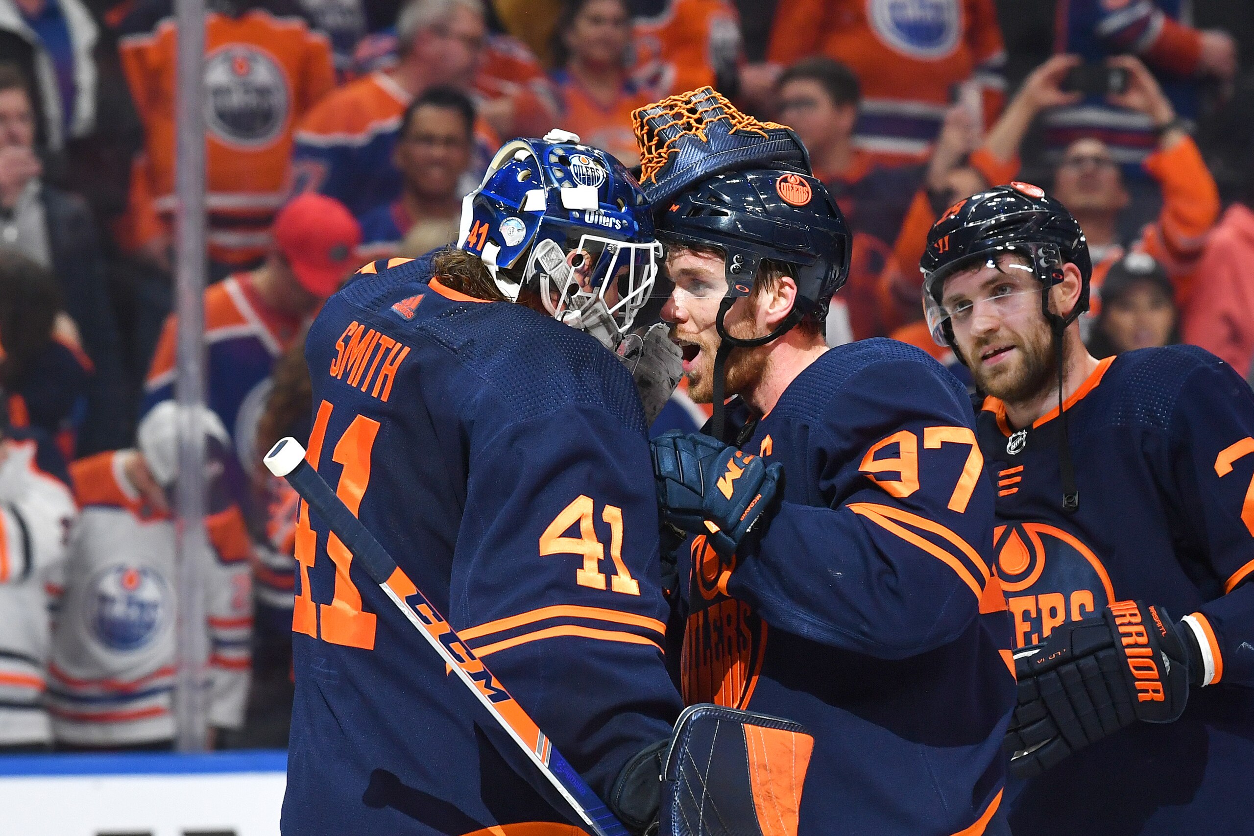 EDMONTON, AB - APRIL 20: Mike Smith #41 and Connor McDavid #97 of the Edmonton Oilers celebrate after winning the game against the Dallas Stars on April 20, 2022 at Rogers Place in Edmonton, Alberta, Canada. (Photo by Andy Devlin/NHLI via Getty Images)