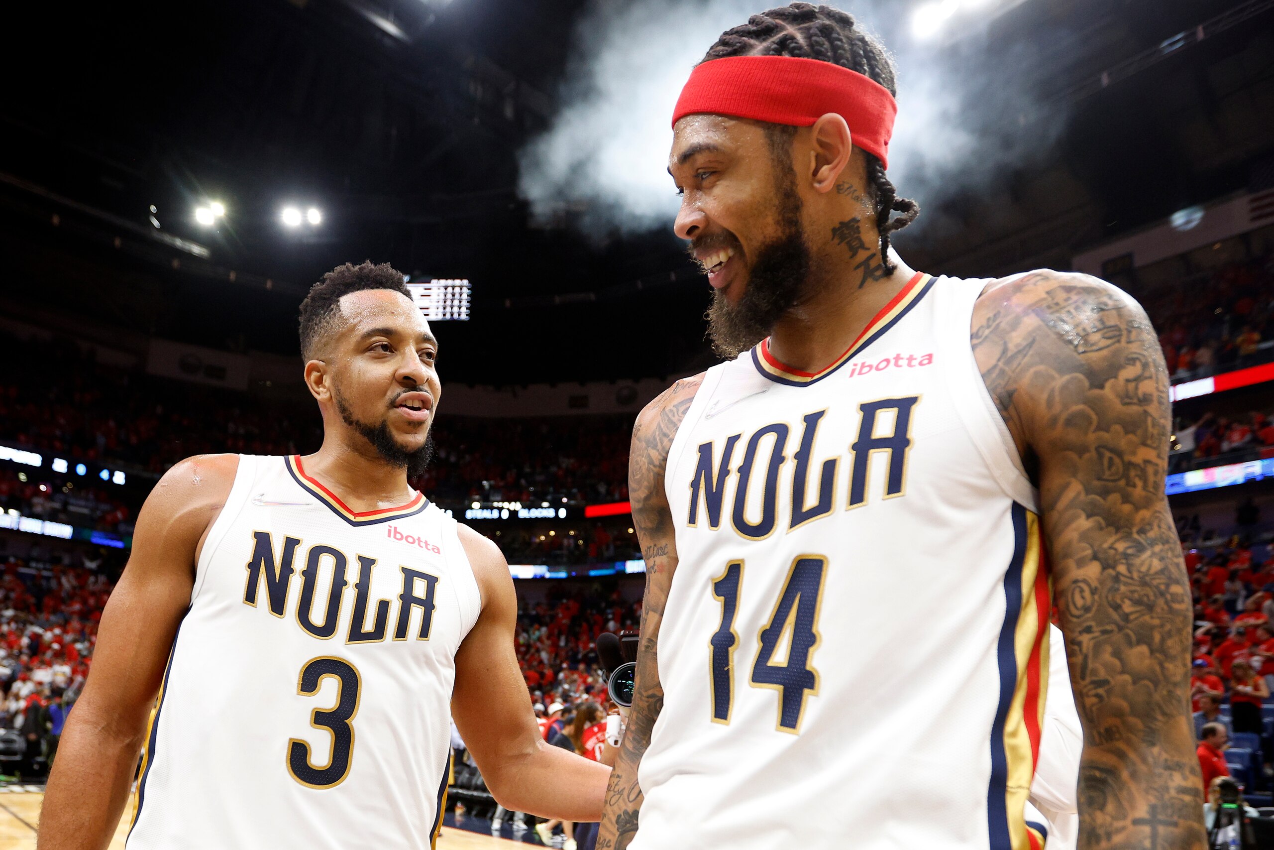 NEW ORLEANS, LOUISIANA - APRIL 13: CJ McCollum #3 of the New Orleans Pelicans and Brandon Ingram #14 of the New Orleans Pelicans react after their team defeated the San Antonio Spurs 113 - 103 after the 2022 NBA Play-In Tournament at Smoothie King Center on April 13, 2022 in New Orleans, Louisiana. NOTE TO USER: User expressly acknowledges and agrees that, by downloading and or using this photograph, User is consenting to the terms and conditions of the Getty Images License Agreement. (Photo by Sean Gardner/Getty Images)