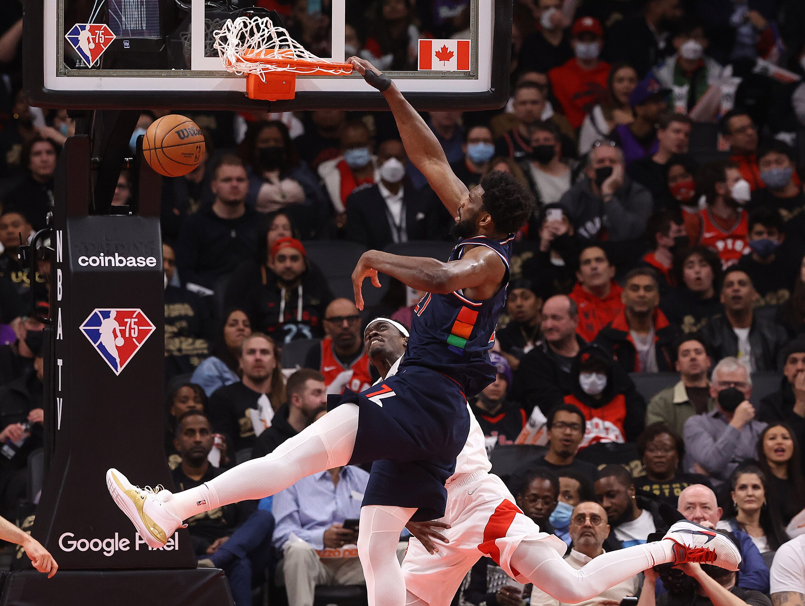 TORONTO, ON- APRIL 20  - Philadelphia 76ers center Joel Embiid (21) dunks on Toronto Raptors forward Pascal Siakam (43)  as the Toronto Raptors fall the Philadelphia 76ers 104-101 in Game 3 of their first round NBA playoff series  in Scotiabank Arena in Toronto. April 20, 2022.        (Steve Russell/Toronto Star via Getty Images)