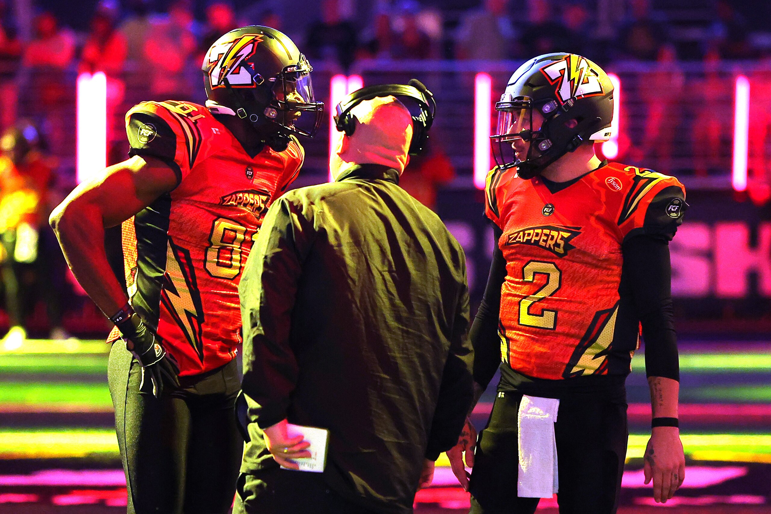 ATLANTA, GEORGIA - APRIL 23: Terrell Owens #81 and Johnny Manziel #2 of Zappers talk with a coach in the first half against the Glacier Boyz during Fan Controlled Football Season v2.0 - Week Two on April 23, 2022 in Atlanta, Georgia. (Photo by Kevin C. Cox/Fan Controlled Football/Getty Images)