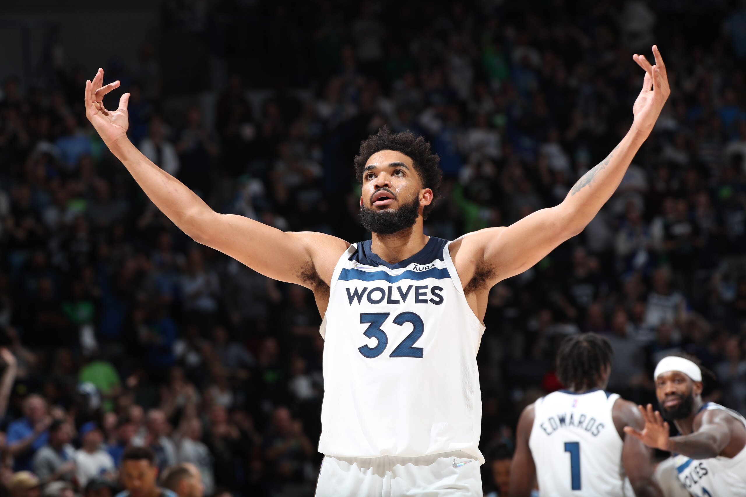 MINNEAPOLIS, MN -  APRIL 23: Karl-Anthony Towns #32 of the Minnesota Timberwolves cheers during Round 1 Game 4 of the 2022 NBA Playoffs on April 23, 2022 at Target Center in Minneapolis, Minnesota. NOTE TO USER: User expressly acknowledges and agrees that, by downloading and or using this Photograph, user is consenting to the terms and conditions of the Getty Images License Agreement. Mandatory Copyright Notice: Copyright 2022 NBAE (Photo by Joe Murphy/NBAE via Getty Images)