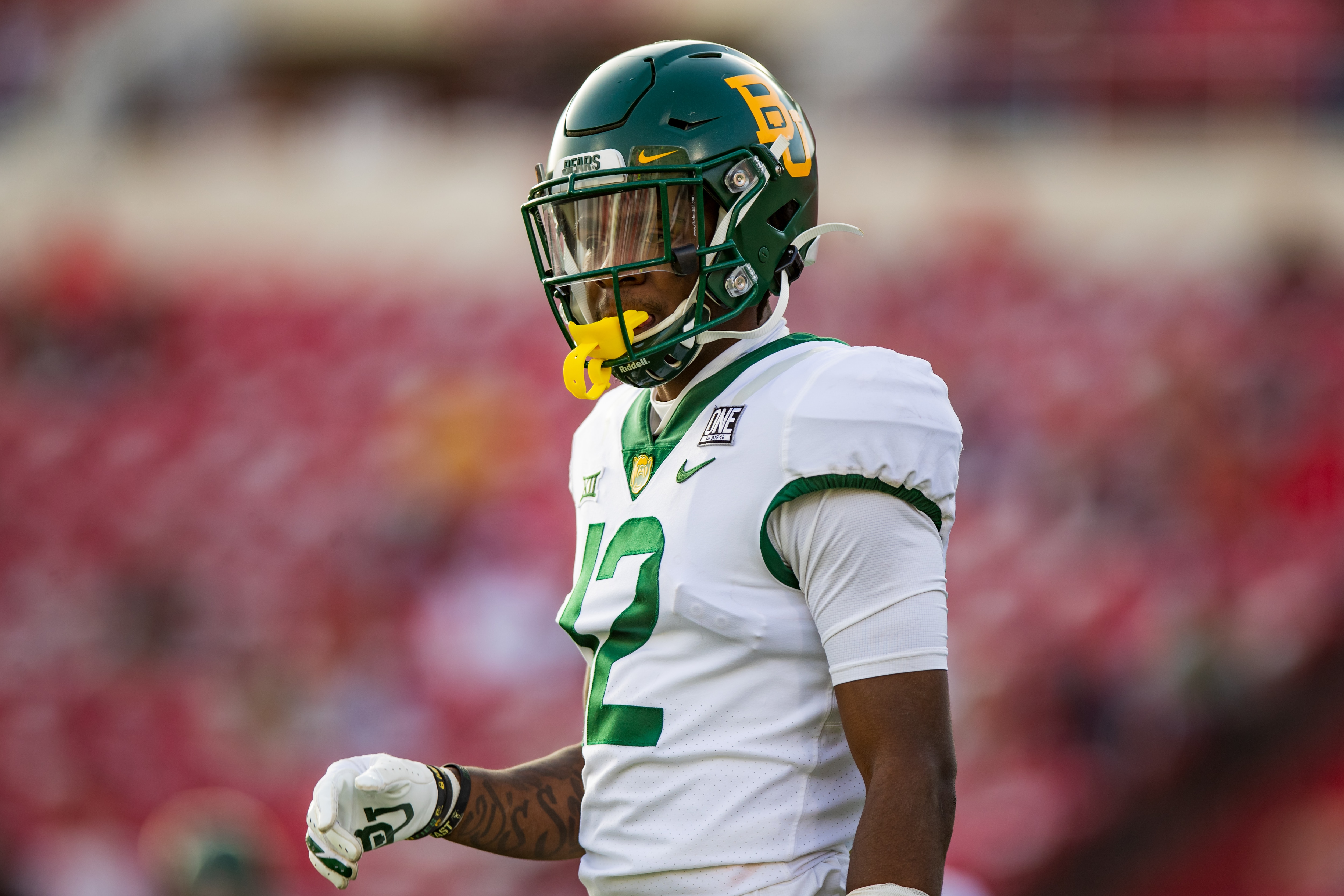 LUBBOCK, TEXAS - NOVEMBER 14: Cornerback Kalon Barnes #12 of the Baylor Bears looks to the sideline during the first half of the college football game against the Texas Tech Red Raiders at Jones AT&T Stadium on November 14, 2020 in Lubbock, Texas. (Photo by John E. Moore III/Getty Images)