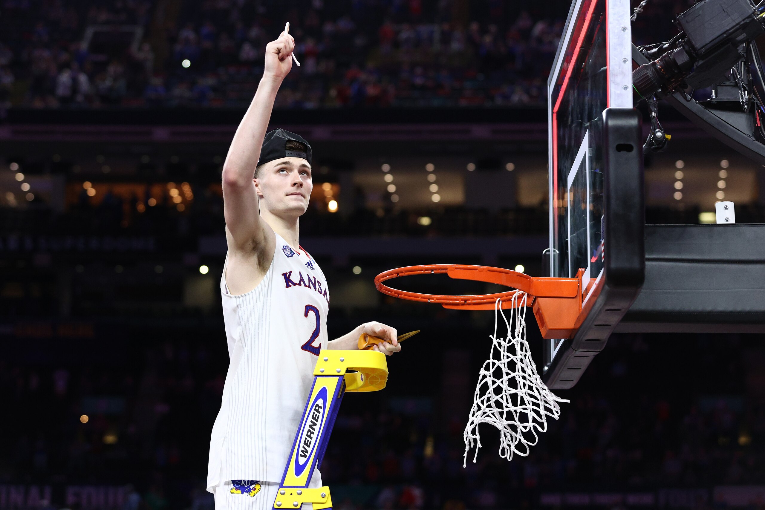 NEW ORLEANS, LOUISIANA - APRIL 04: Christian Braun #2 of the Kansas Jayhawks cuts down the net after defeating the North Carolina Tar Heels 72-69 during the 2022 NCAA Men's Basketball Tournament National Championship at Caesars Superdome on April 04, 2022 in New Orleans, Louisiana. (Photo by Tom Pennington/Getty Images)