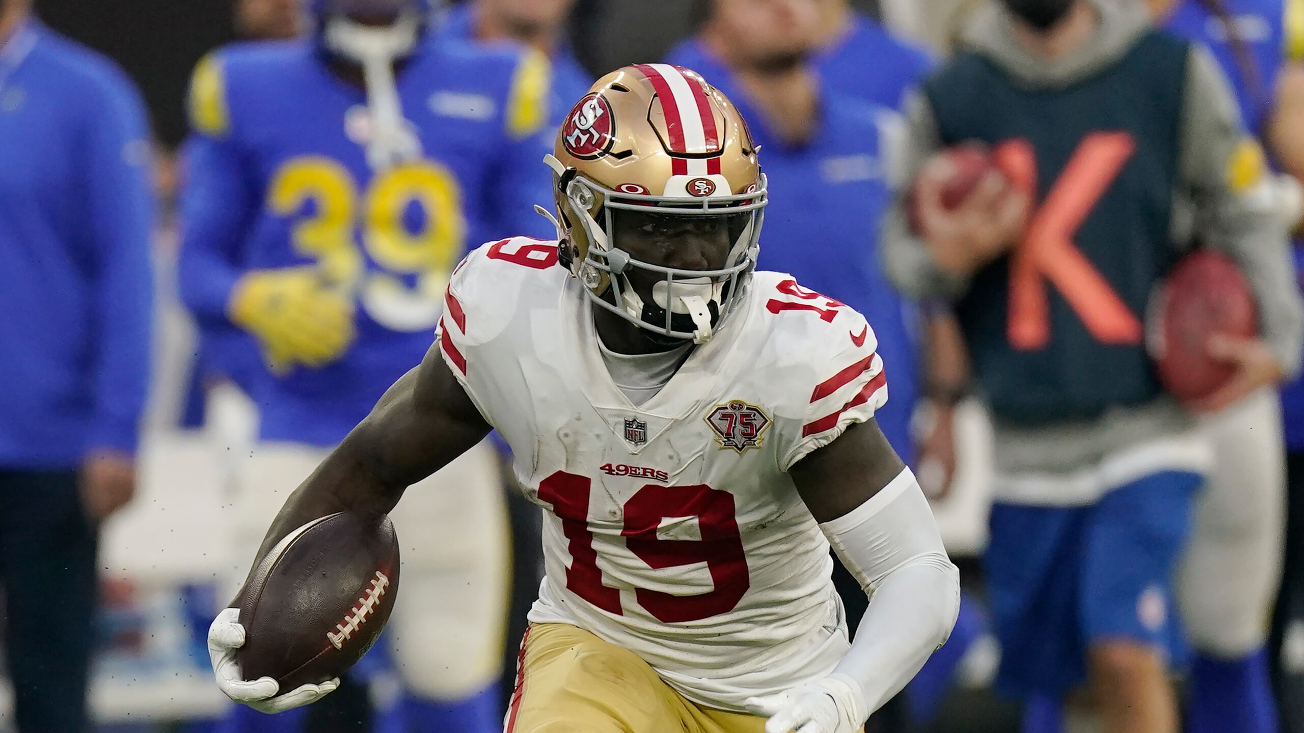 San Francisco 49ers wide receiver Deebo Samuel (19) runs the ball during an NFL football game against the Los Angeles Rams Sunday, Jan. 9, 2022, in Inglewood, Calif. (AP Photo/Mark J. Terrill) San Francisco 49ers wide receiver Deebo Samuel (19) runs the ball during an NFL football game against the Los Angeles Rams Sunday, Jan. 9, 2022, in Inglewood, Calif. (AP Photo/Mark J. Terrill)