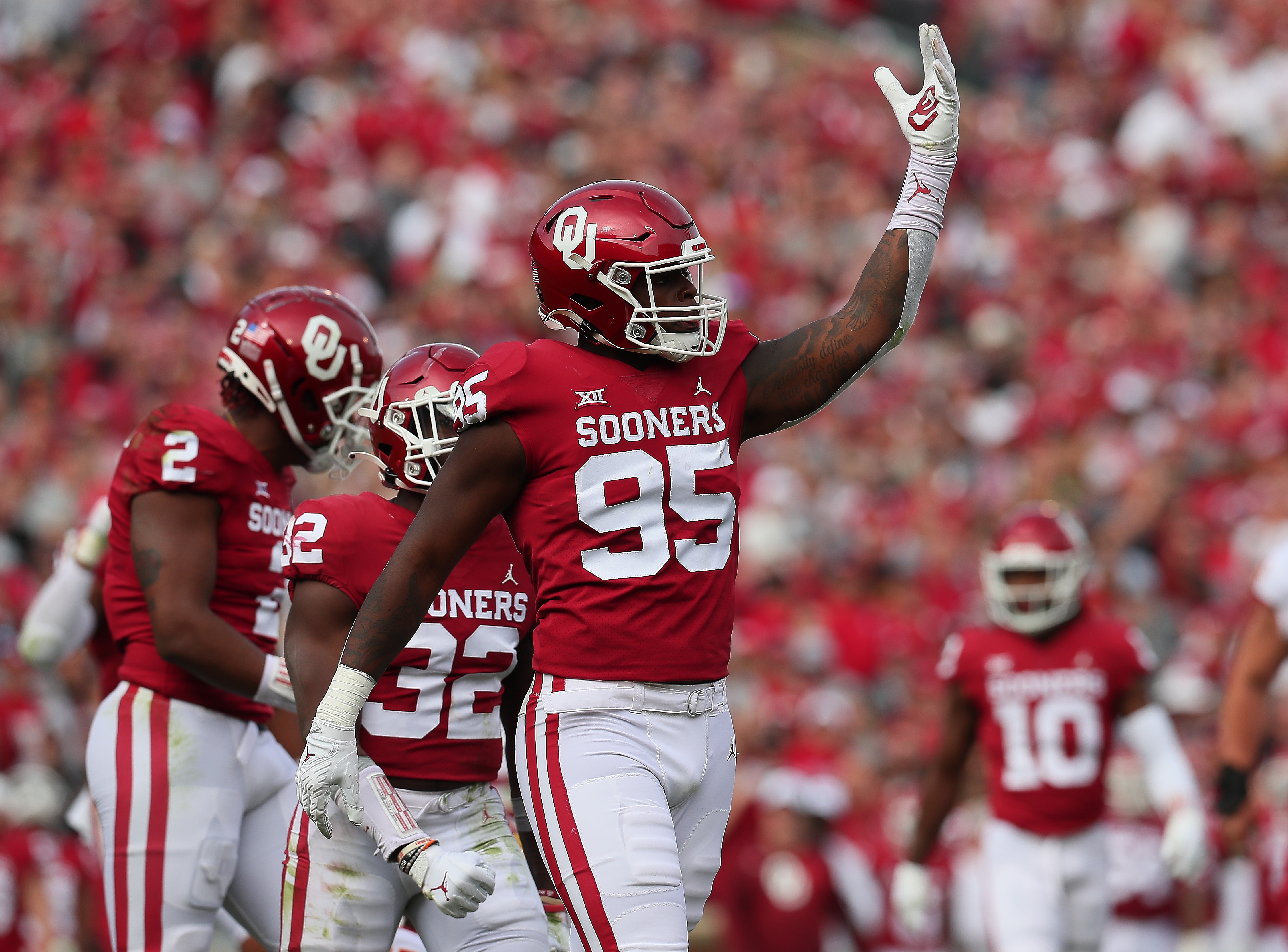 NORMAN, OK - NOVEMBER 20: Oklahoma Sooners DL Isaiah Thomas (95) celebrates after a QB sack during a game between the Oklahoma Sooners and the Iowa State Cyclones on November 20, 2021, at Gaylord Memorial Stadium in Norman, Oklahoma. (Photo by David Stacy/Icon Sportswire via Getty Images)