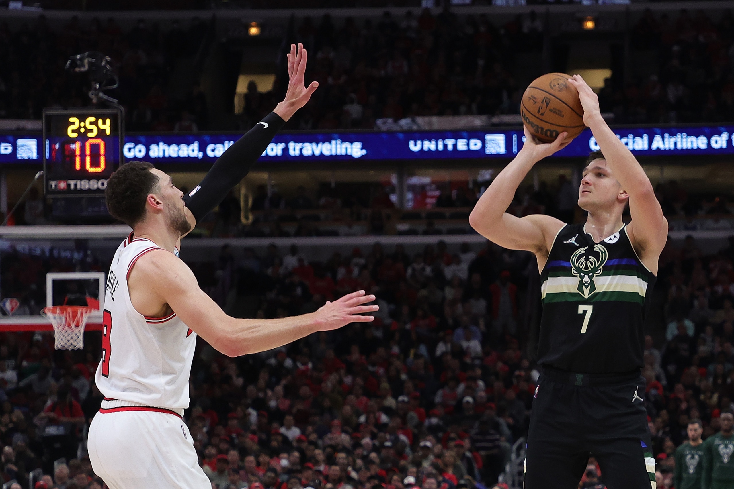 CHICAGO, ILLINOIS - APRIL 22: Grayson Allen #7 of the Milwaukee Bucks is defended by Zach LaVine #8 of the Chicago Bulls \d2q of Game Three of the Eastern Conference First Round Playoffs at the United Center on April 22, 2022 in Chicago, Illinois. NOTE TO USER: User expressly acknowledges and agrees that, by downloading and or using this photograph, User is consenting to the terms and conditions of the Getty Images License Agreement. (Photo by Stacy Revere/Getty Images)
