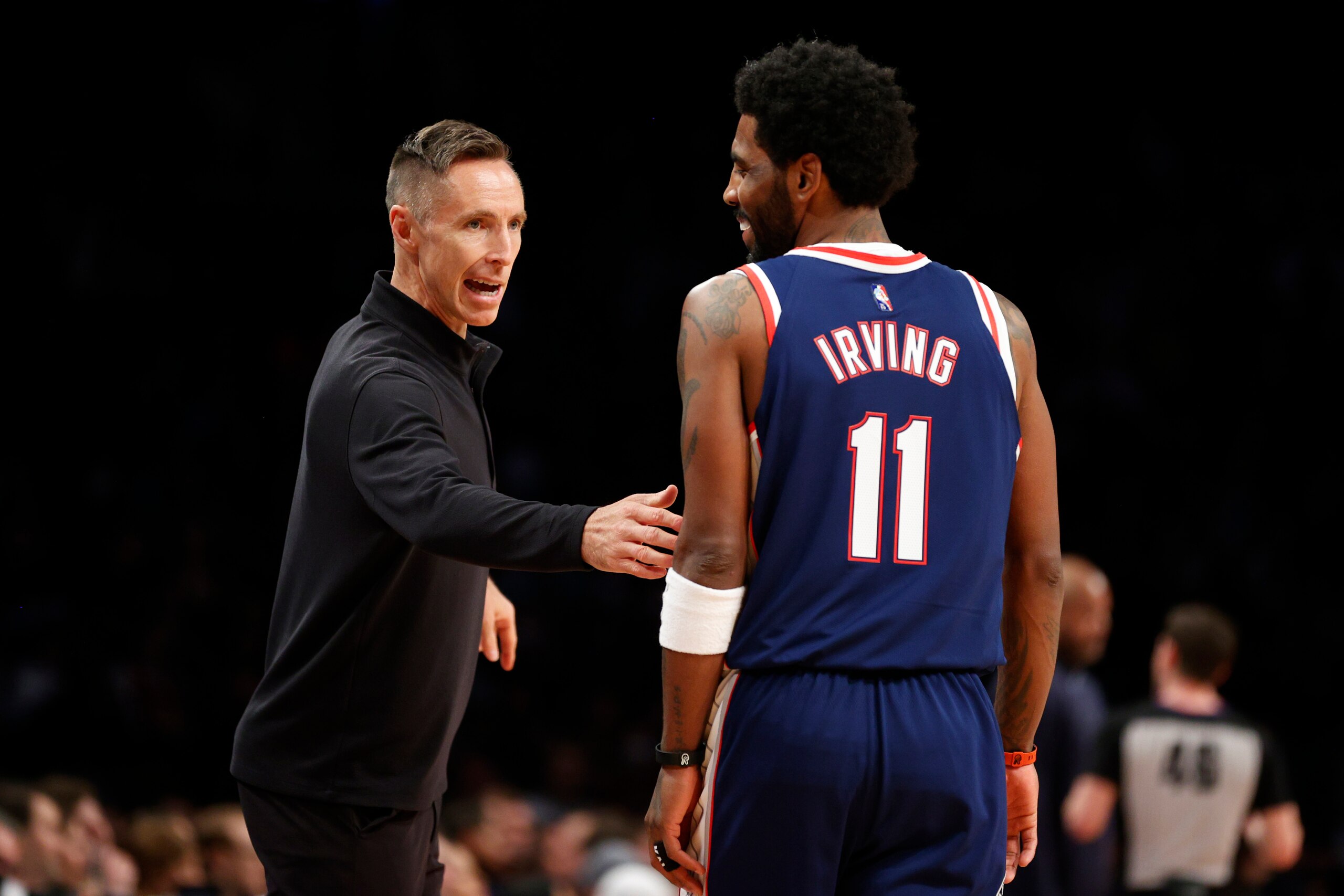 NEW YORK, NEW YORK - APRIL 08: Head coach Steve Nash of the Brooklyn Nets talks with Kyrie Irving #11 during the first half against the Cleveland Cavaliers at Barclays Center on April 08, 2022 in the Brooklyn borough of New York City. NOTE TO USER: User expressly acknowledges and agrees that, by downloading and or using this photograph, User is consenting to the terms and conditions of the Getty Images License Agreement. (Photo by Sarah Stier/Getty Images) NEW YORK, NEW YORK - APRIL 08: Head coach Steve Nash of the Brooklyn Nets talks with Kyrie Irving #11 during the first half against the Cleveland Cavaliers at Barclays Center on April 08, 2022 in the Brooklyn borough of New York City. NOTE TO USER: User expressly acknowledges and agrees that, by downloading and or using this photograph, User is consenting to the terms and conditions of the Getty Images License Agreement. (Photo by Sarah Stier/Getty Images)
