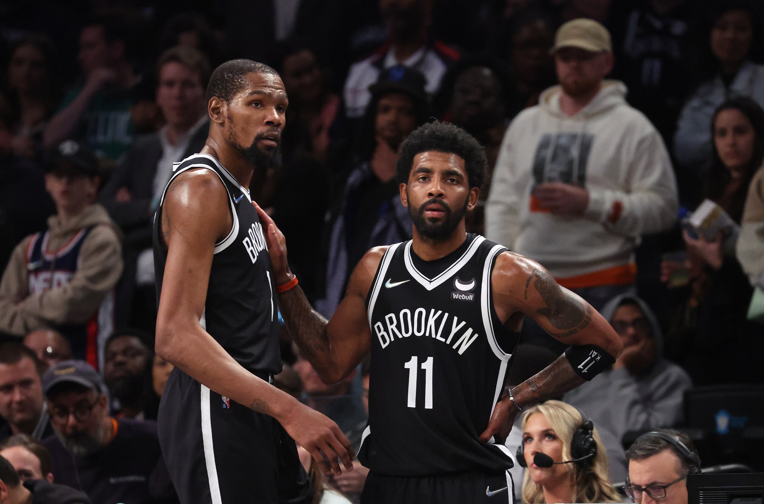 NEW YORK, NEW YORK - APRIL 23:  Kevin Durant #7 and Kyrie Irving #11 of the Brooklyn Nets look on in the final seconds of their 109-103 loss against the Boston Celtics during Game Three of the Eastern Conference First Round NBA Playoffs at Barclays Center on April 23, 2022 in New York City.  NOTE TO USER: User expressly acknowledges and agrees that, by downloading and or using this photograph, User is consenting to the terms and conditions of the Getty Images License Agreement.  (Photo by Al Bello/Getty Images).