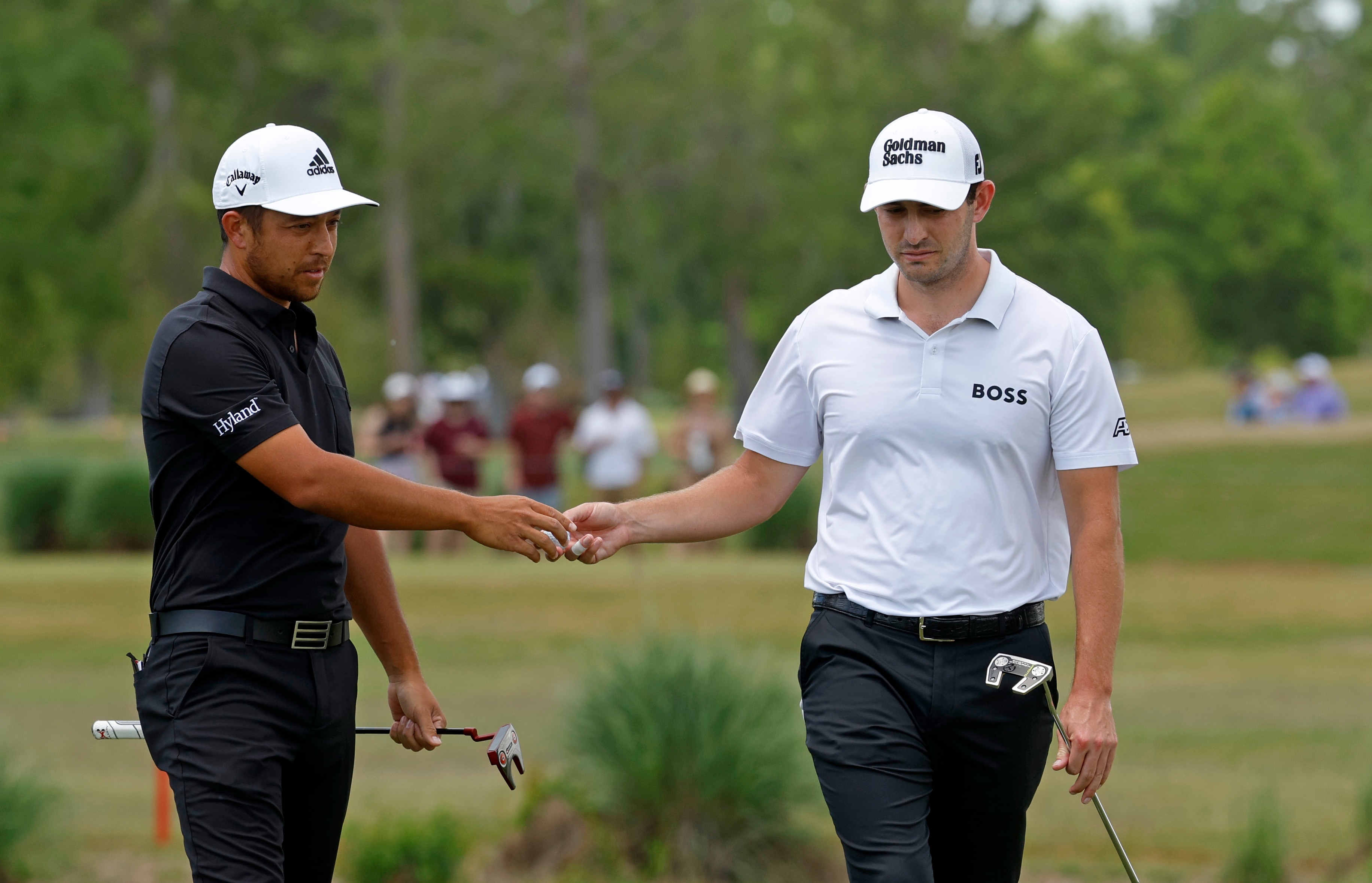 AVONDALE, LOUISIANA - APRIL 24: Xander Schauffele and Patrick Cantlay react on the third green  during the final round of the Zurich Classic of New Orleans at TPC Louisiana on April 24, 2022 in Avondale, Louisiana. (Photo by Chris Graythen/Getty Images)