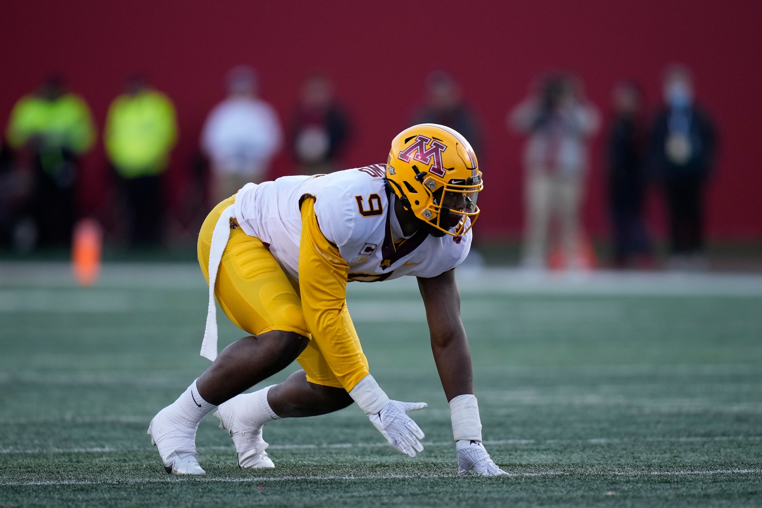 Minnesota defensive lineman Esezi Otomewo (9) in action during an NCAA college football game between Minnesota and Indiana in Bloomington, Ind., Saturday, Nov. 20, 2021. (AP Photo/AJ Mast)