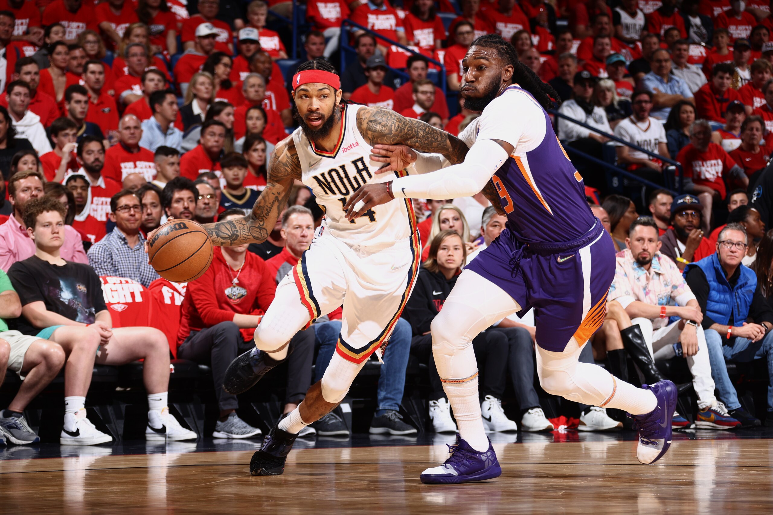 NEW ORLEANS, LA - APRIL 24: Brandon Ingram #14 of the New Orleans Pelicans dribbles the ball during the game against the Phoenix Suns during Round 1 Game 4 of the 2022 NBA Playoffs on April 24, 2022 at the Smoothie King Center in New Orleans, Louisiana. NOTE TO USER: User expressly acknowledges and agrees that, by downloading and or using this Photograph, user is consenting to the terms and conditions of the Getty Images License Agreement. Mandatory Copyright Notice: Copyright 2022 NBAE (Photo by Ned Dishman/NBAE via Getty Images)