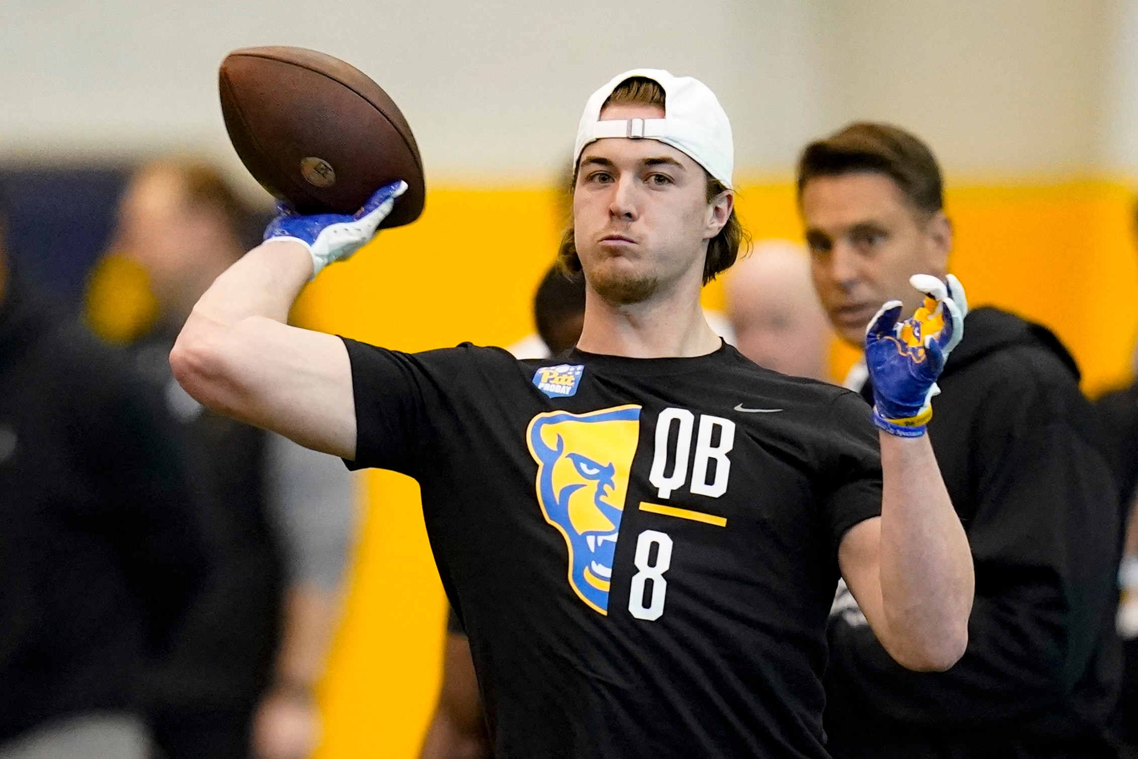 Quarterback Kenny Pickett (8) goes through passing drills during Pittsburgh's football pro day , Monday, March 21, 2022, in Pittsburgh. (AP Photo/Keith Srakocic)