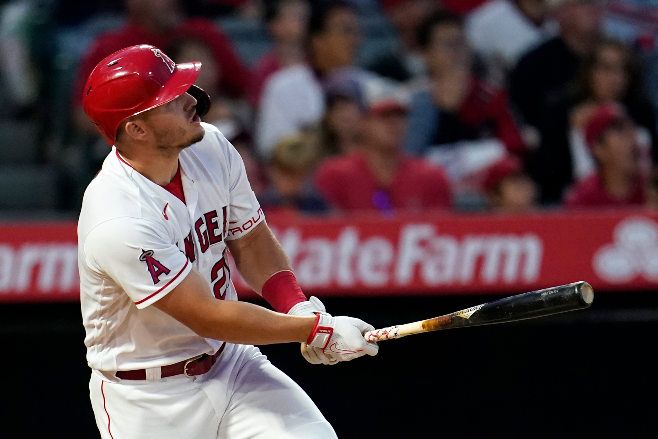 Los Angeles Angels' Mike Trout watches his solo home run during the fifth inning against the Baltimore Orioles in a baseball game Saturday, April 23, 2022, in Anaheim, Calif. (AP Photo/Marcio Jose Sanchez)