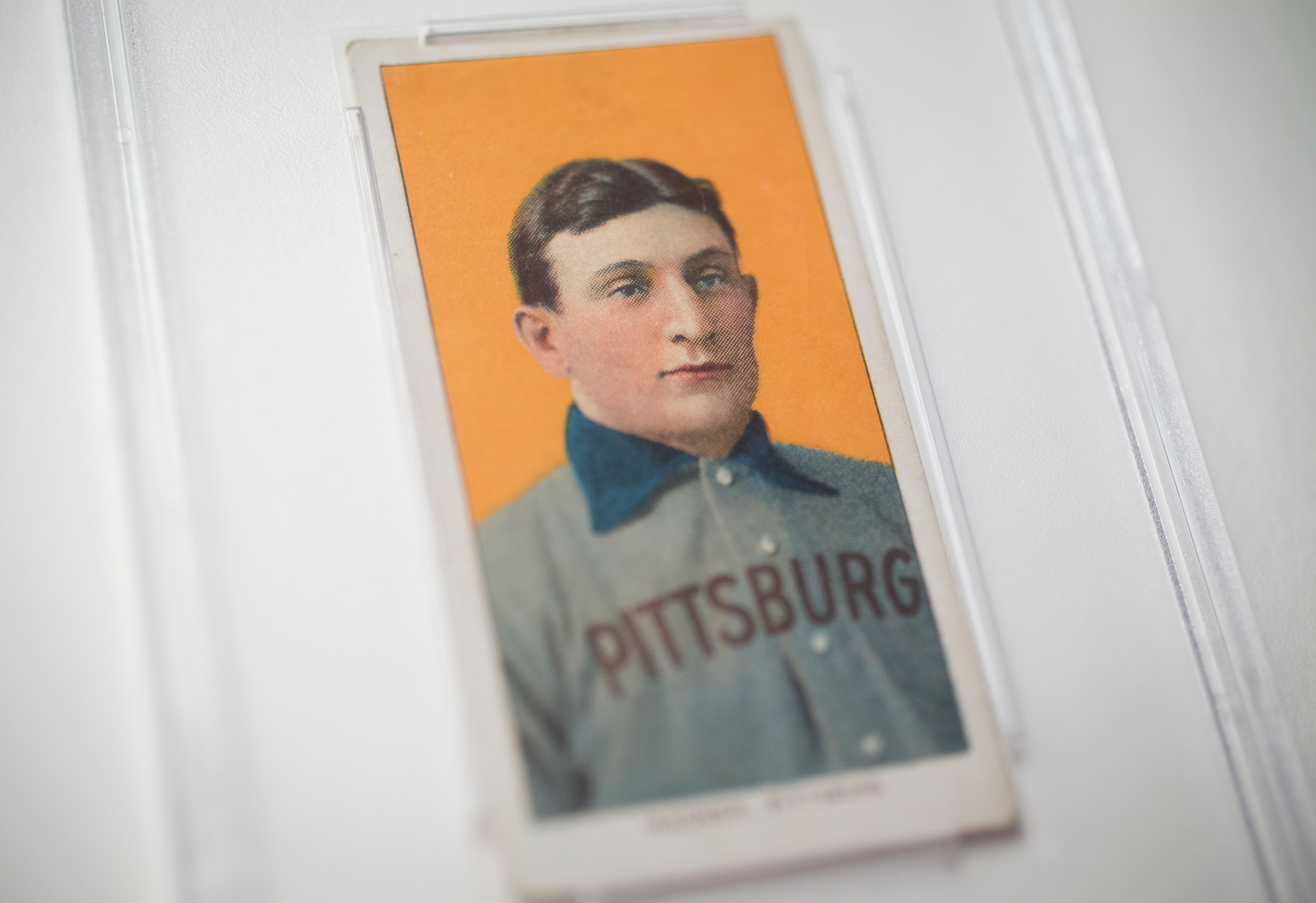 The 1909 baseball card of Pittsburgh Pirates shortstop Honus Wagner is displayed for a photograph in New York, U.S., on Tuesday, Feb. 19, 2013. The trading card that the National Baseball Hall of Fame calls the sport's "most famous collectible" will be up for sale starting Feb. 25,  and might fetch more than $2.8 million, according to the auction house. Photographer: Scott Eells/Bloomberg via Getty Images