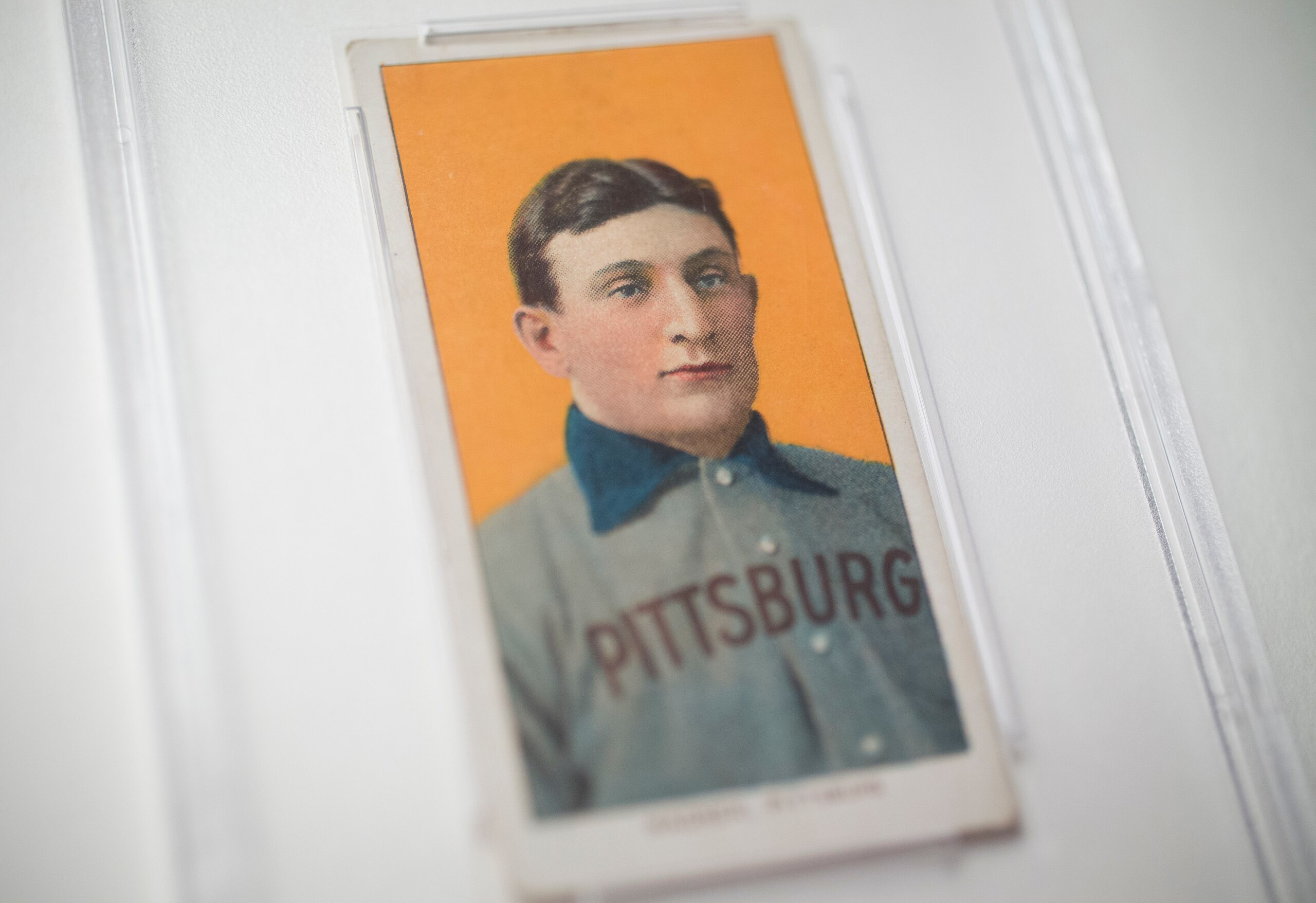 The 1909 baseball card of Pittsburgh Pirates shortstop Honus Wagner is displayed for a photograph in New York, U.S., on Tuesday, Feb. 19, 2013. The trading card that the National Baseball Hall of Fame calls the sport's "most famous collectible" will be up for sale starting Feb. 25,  and might fetch more than $2.8 million, according to the auction house. Photographer: Scott Eells/Bloomberg via Getty Images