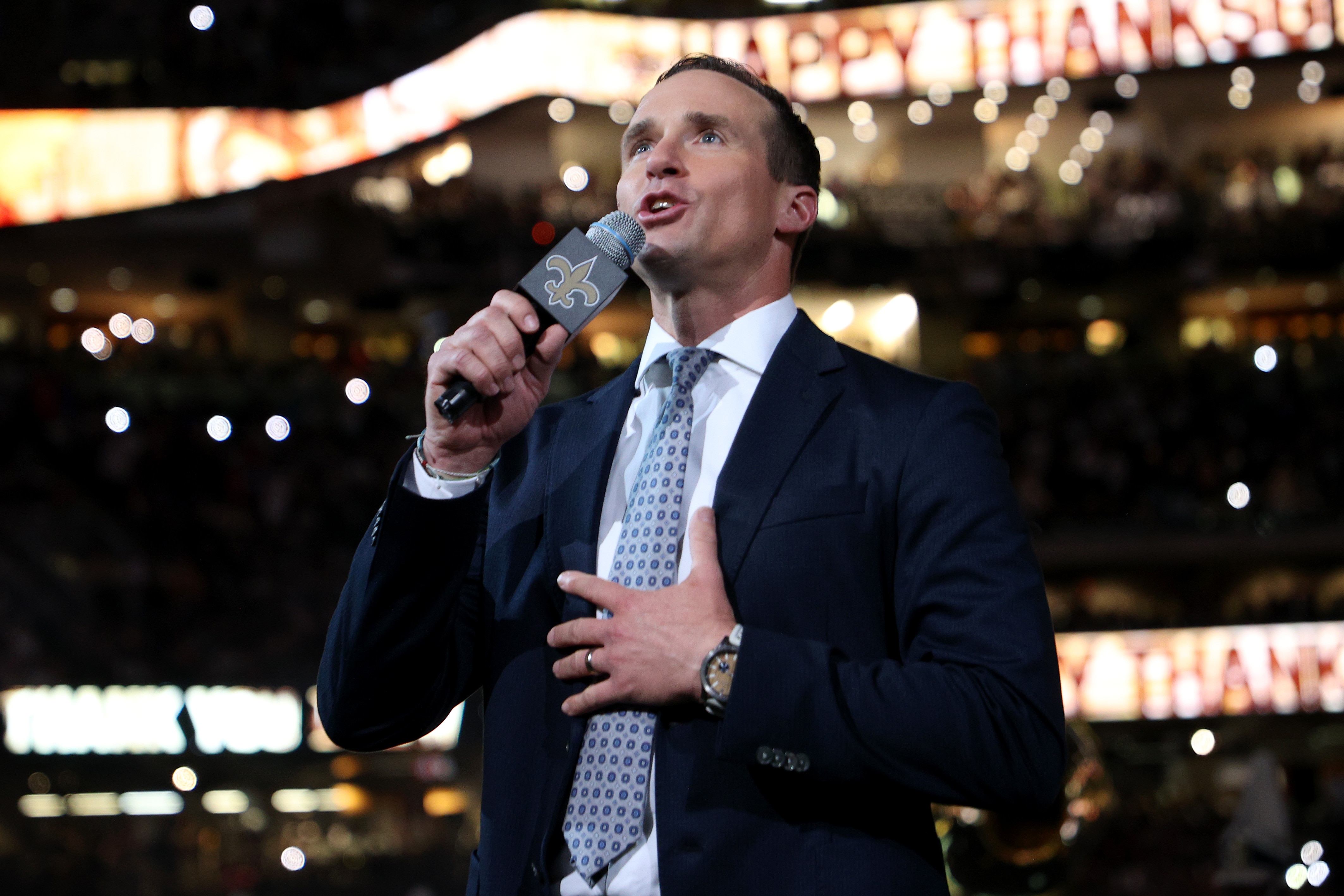 NEW ORLEANS, LOUISIANA - NOVEMBER 25: Former New Orleans Saints quarterback Drew Brees speaks to the fans during halftime of the game between the Buffalo Bills and the New Orleans Saints at Caesars Superdome on November 25, 2021 in New Orleans, Louisiana. (Photo by Chris Graythen/Getty Images)