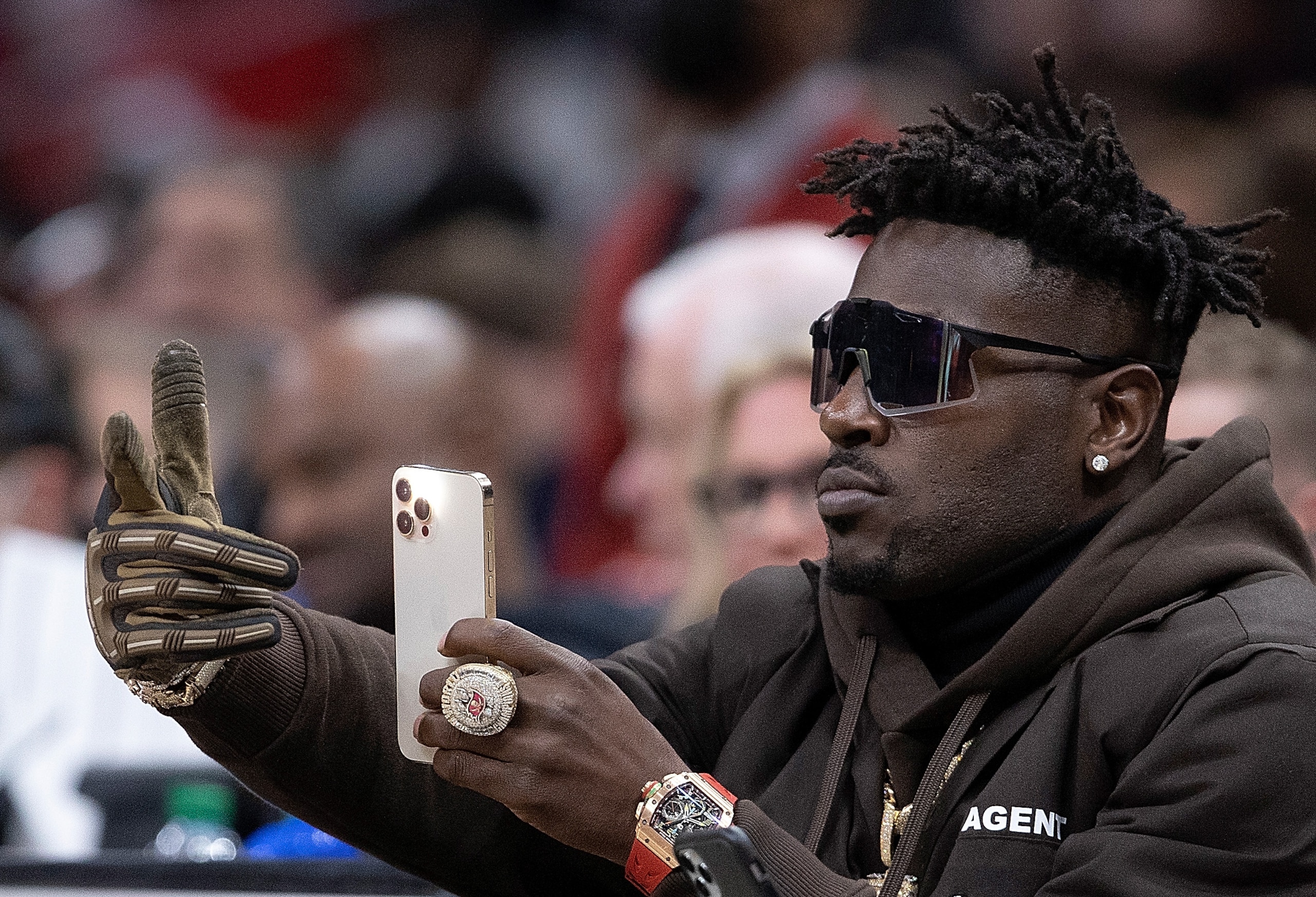 ATLANTA, GEORGIA - MARCH 11:  NFL player Antonio Brown looks on during the second half of the game between the Atlanta Hawks and the Los Angeles Clippers at State Farm Arena on March 11, 2022 in Atlanta, Georgia.  NOTE TO USER: User expressly acknowledges and agrees that, by downloading and or using this photograph, User is consenting to the terms and conditions of the Getty Images License Agreement. (Photo by Kevin C. Cox/Getty Images)