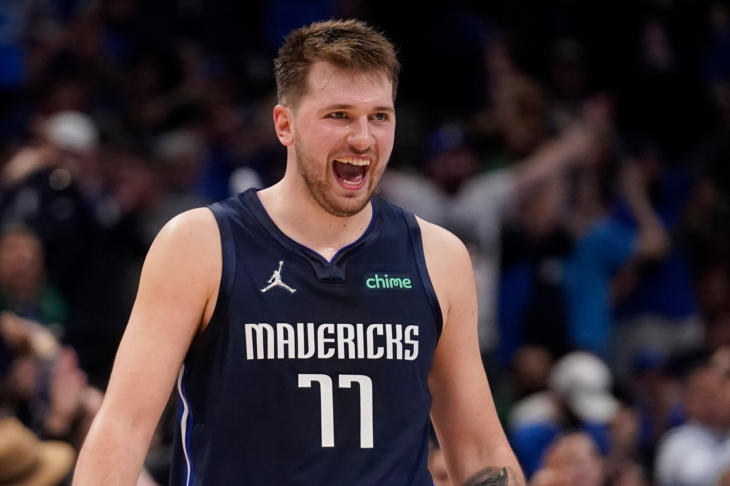 Dallas Mavericks guard Luka Doncic (77) celebrates after scoring against the Utah Jazz during the second half of Game 5 of an NBA basketball first-round playoff series, Monday, April 25, 2022, in Dallas. (AP Photo/Tony Gutierrez)