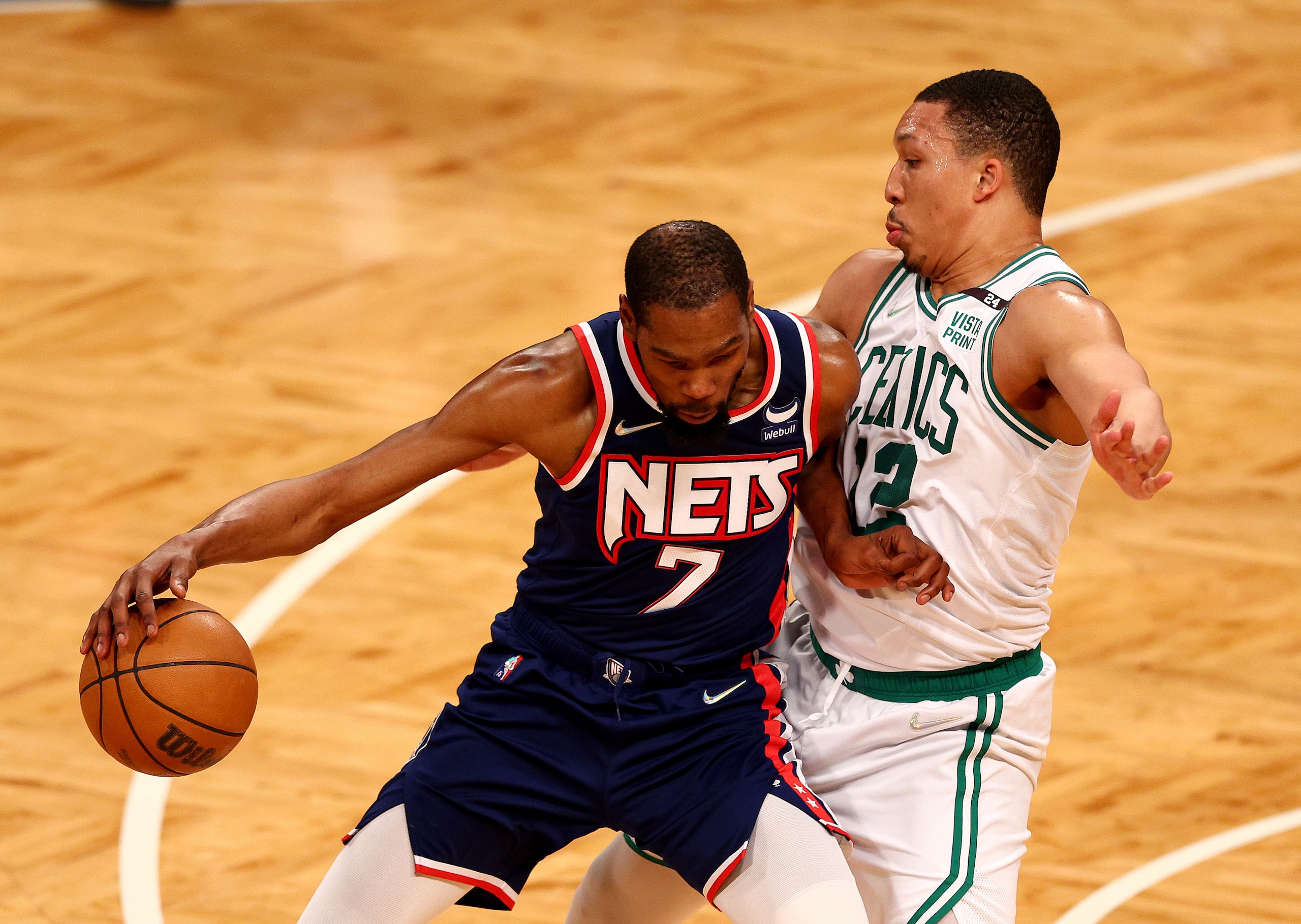 NEW YORK, NEW YORK - APRIL 25: Kevin Durant #7 of the Brooklyn Nets tries to get past Grant Williams #12 of the Boston Celtics in the first half during Game Four of the Eastern Conference First Round Playoffs against the Boston Celtics at Barclays Center on April 25, 2022 in the Brooklyn borough of New York City. NOTE TO USER: User expressly acknowledges and agrees that, by downloading and or using this photograph, User is consenting to the terms and conditions of the Getty Images License Agreement. (Photo by Elsa/Getty Images)