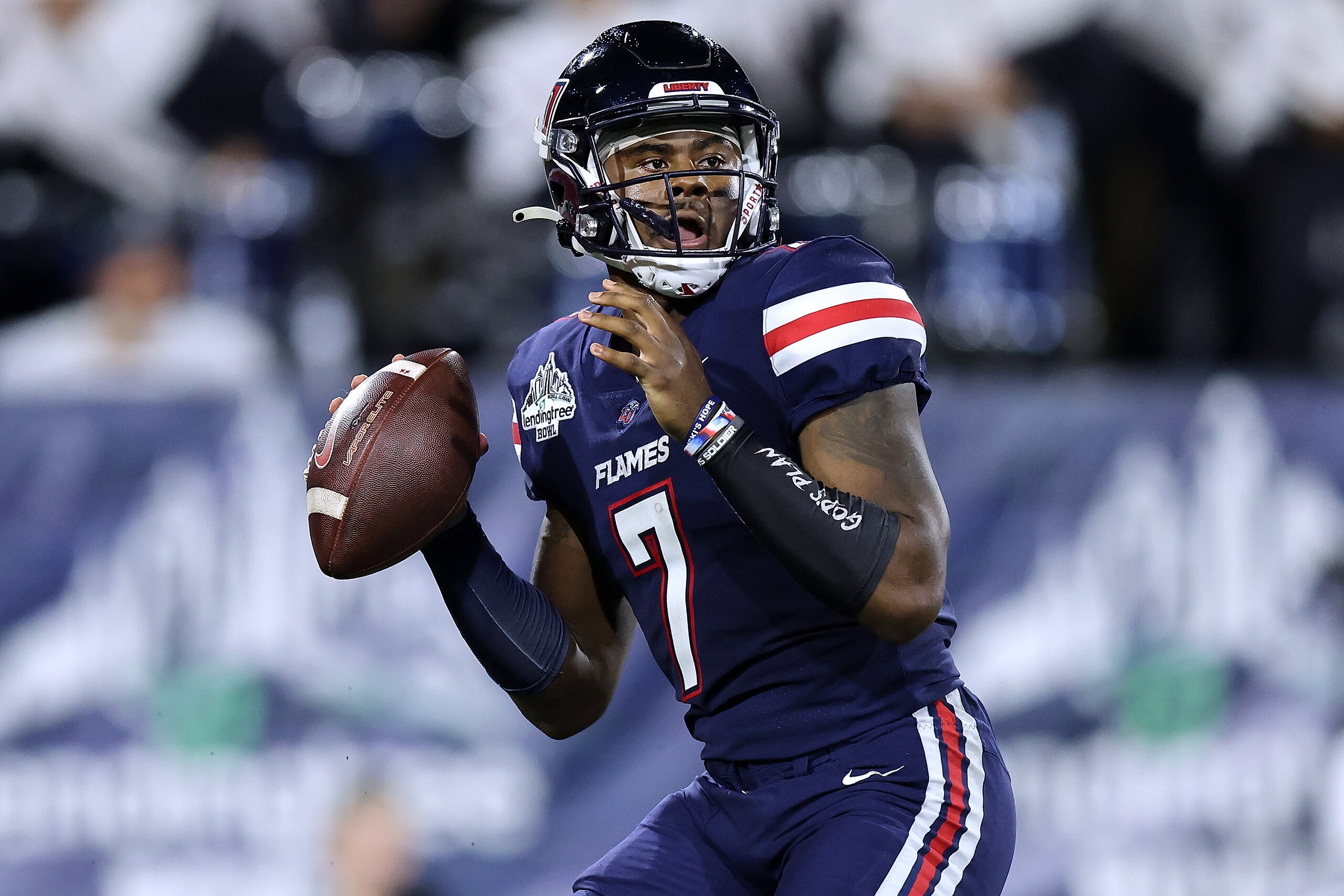MOBILE, ALABAMA - DECEMBER 18: Malik Willis #7 of the Liberty Flames throws the the ball during the LendingTree Bowl at Hancock Whitney Stadium on December 18, 2021 in Mobile, Alabama. (Photo by Jonathan Bachman/Getty Images)
