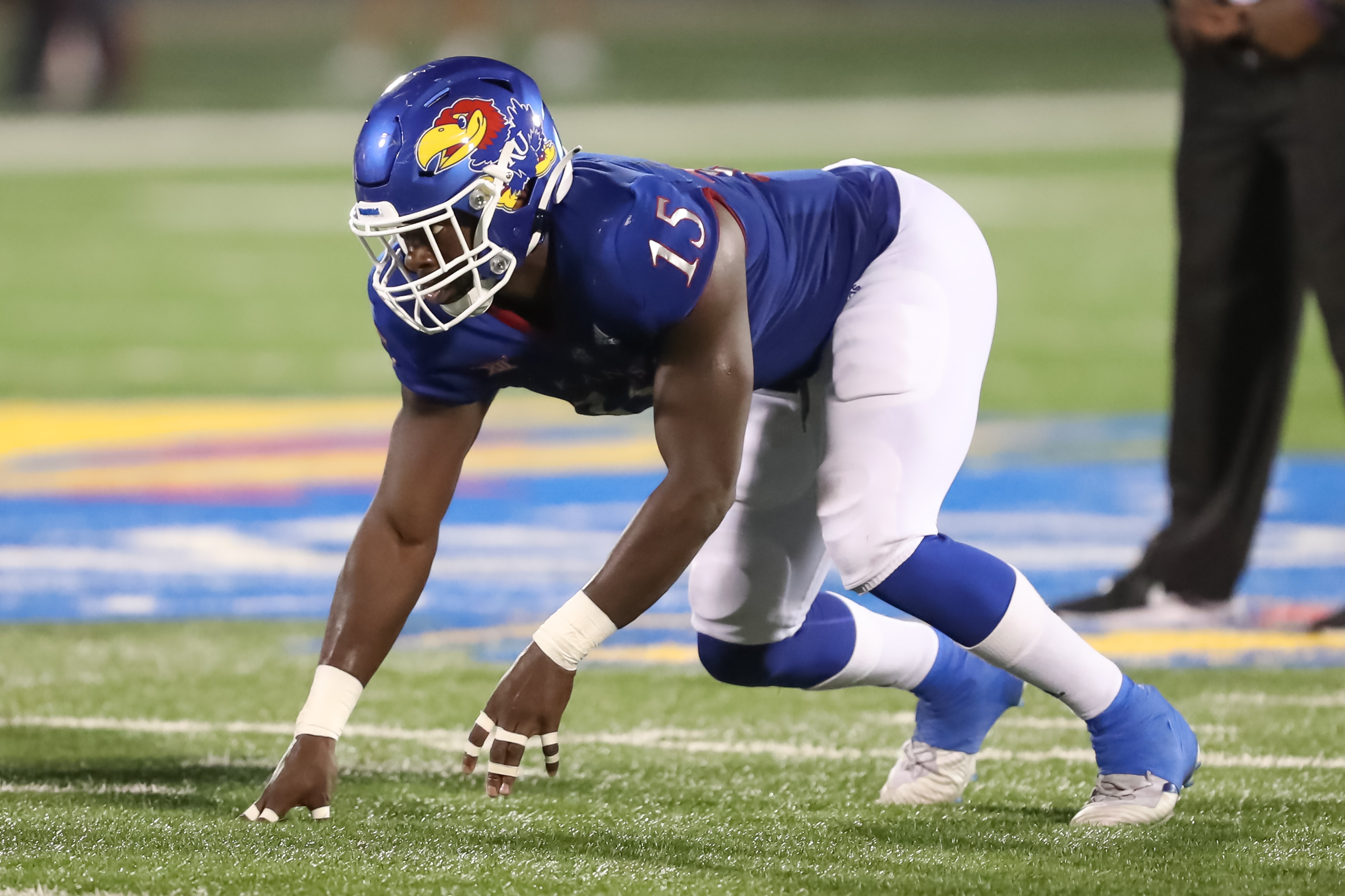 LAWRENCE, KS - SEPTEMBER 03: Kansas Jayhawks defensive end Kyron Johnson (15) in his stance before the snap in the fourth quarter of a college football game between the South Dakota Coyotes and Kansas Jayhawks on Sep 3, 2021 at Memorial Stadium in Lawrence, KS. (Photo by Scott Winters/Icon Sportswire via Getty Images)