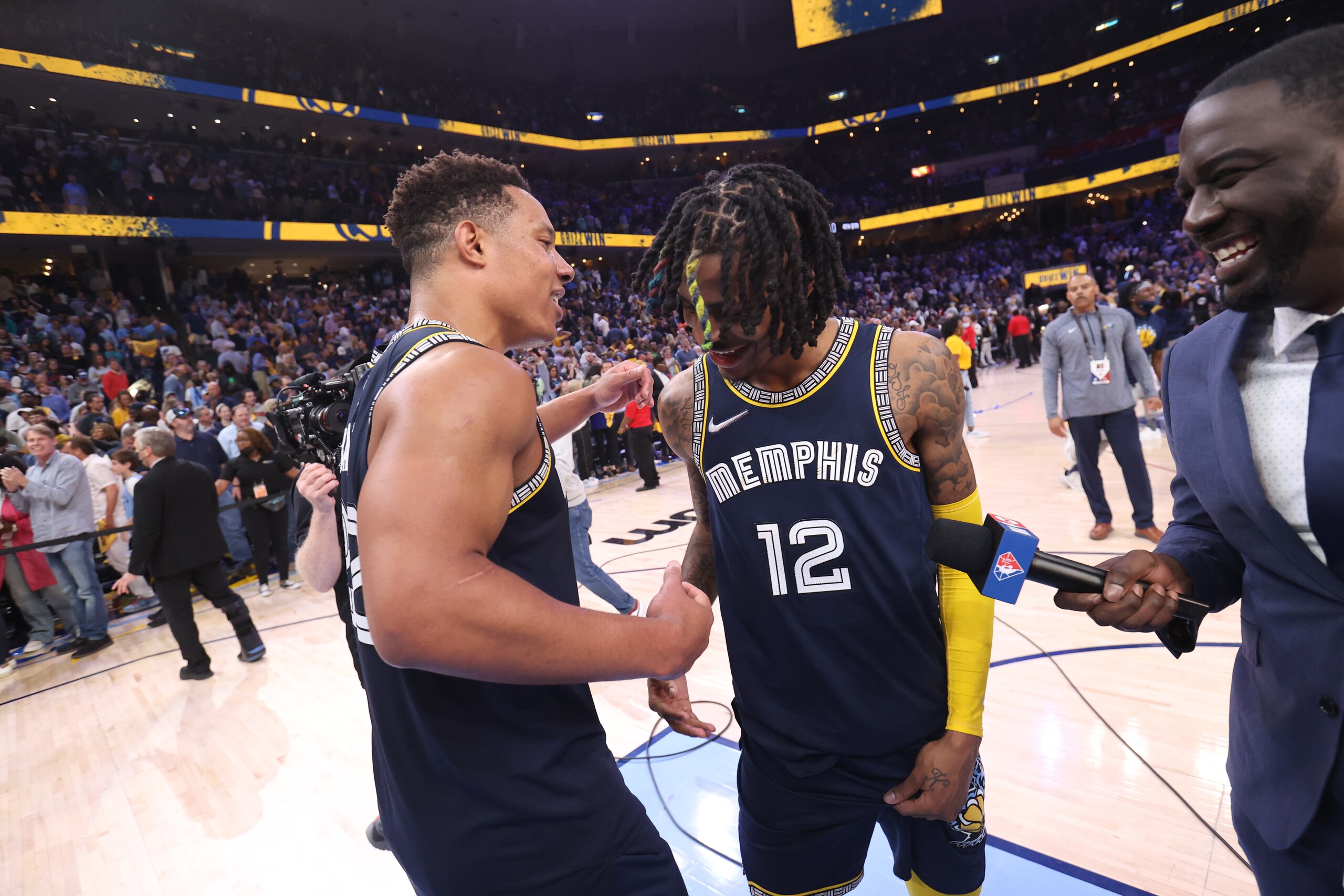 MEMPHIS, TN - APRIL 26: Desmond Bane #22 and Ja Morant #12 of the Memphis Grizzlies embrace after the game against the Minnesota Timberwolves during Round 1 Game 5 of the 2022 NBA Playoffs on April 26, 2022 at FedExForum in Memphis, Tennessee. NOTE TO USER: User expressly acknowledges and agrees that, by downloading and or using this photograph, User is consenting to the terms and conditions of the Getty Images License Agreement. Mandatory Copyright Notice: Copyright 2022 NBAE (Photo by Joe Murphy/NBAE via Getty Images)