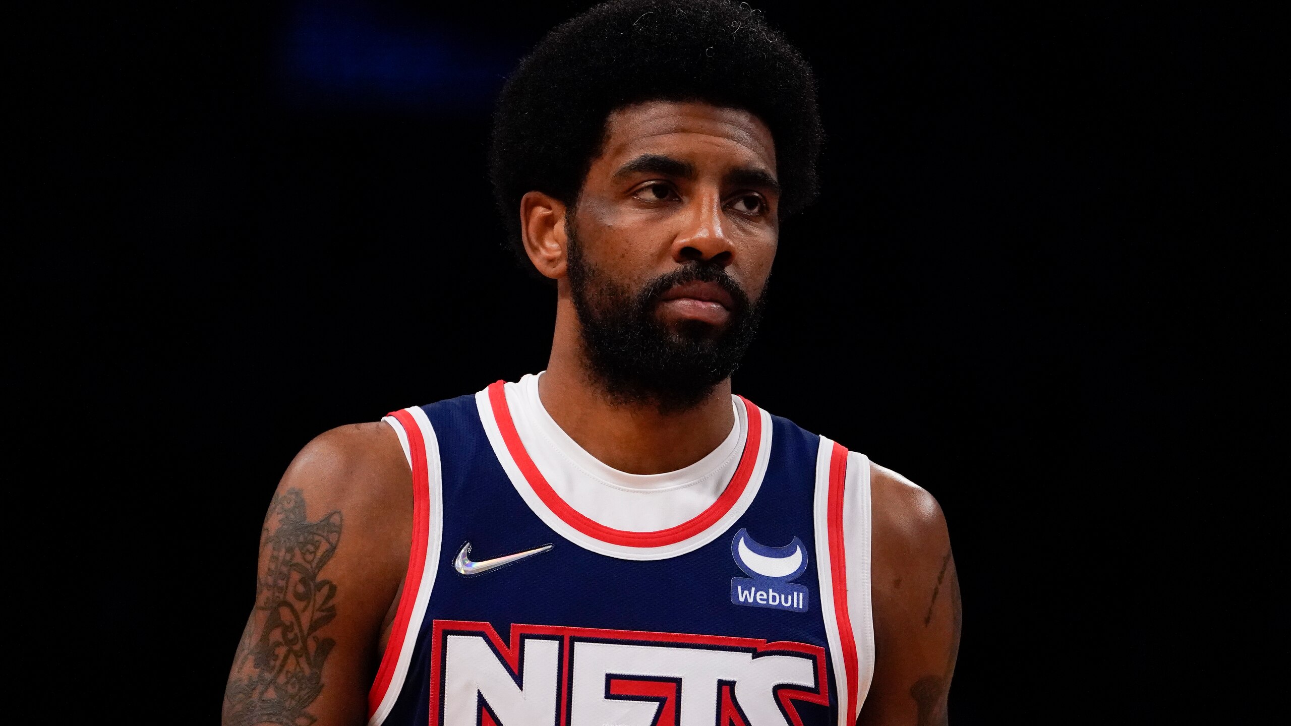 Brooklyn Nets guard Kyrie Irving (11) walks up the court during the first half of Game 4 of an NBA basketball first-round playoff series against the Boston Celtics, Monday, April 25, 2022, in New York. (AP Photo/John Minchillo)