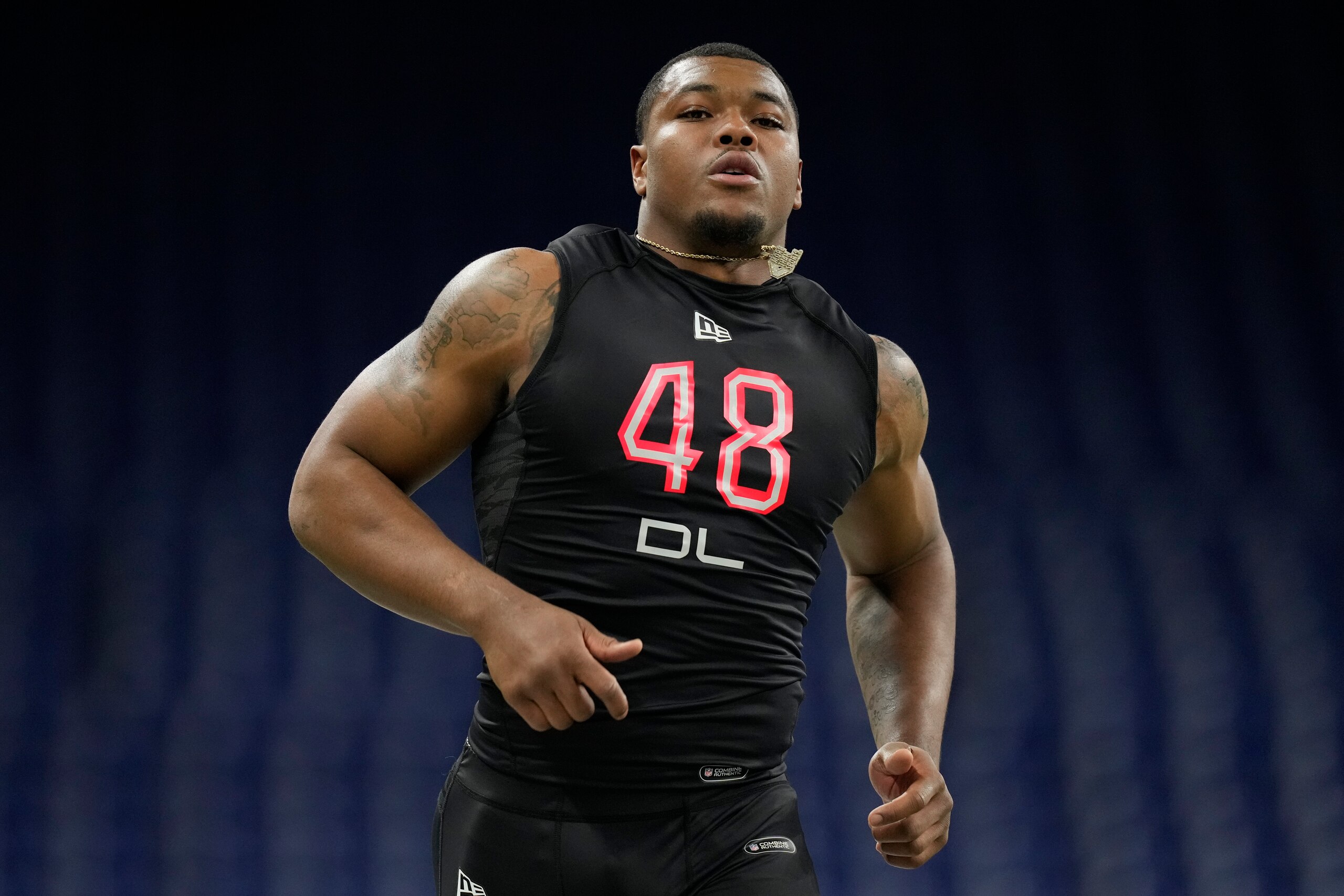 Georgia defensive lineman Travon Walker runs the 40-yard dash at the NFL football scouting combine, Saturday, March 5, 2022, in Indianapolis. (AP Photo/Charlie Neibergall)