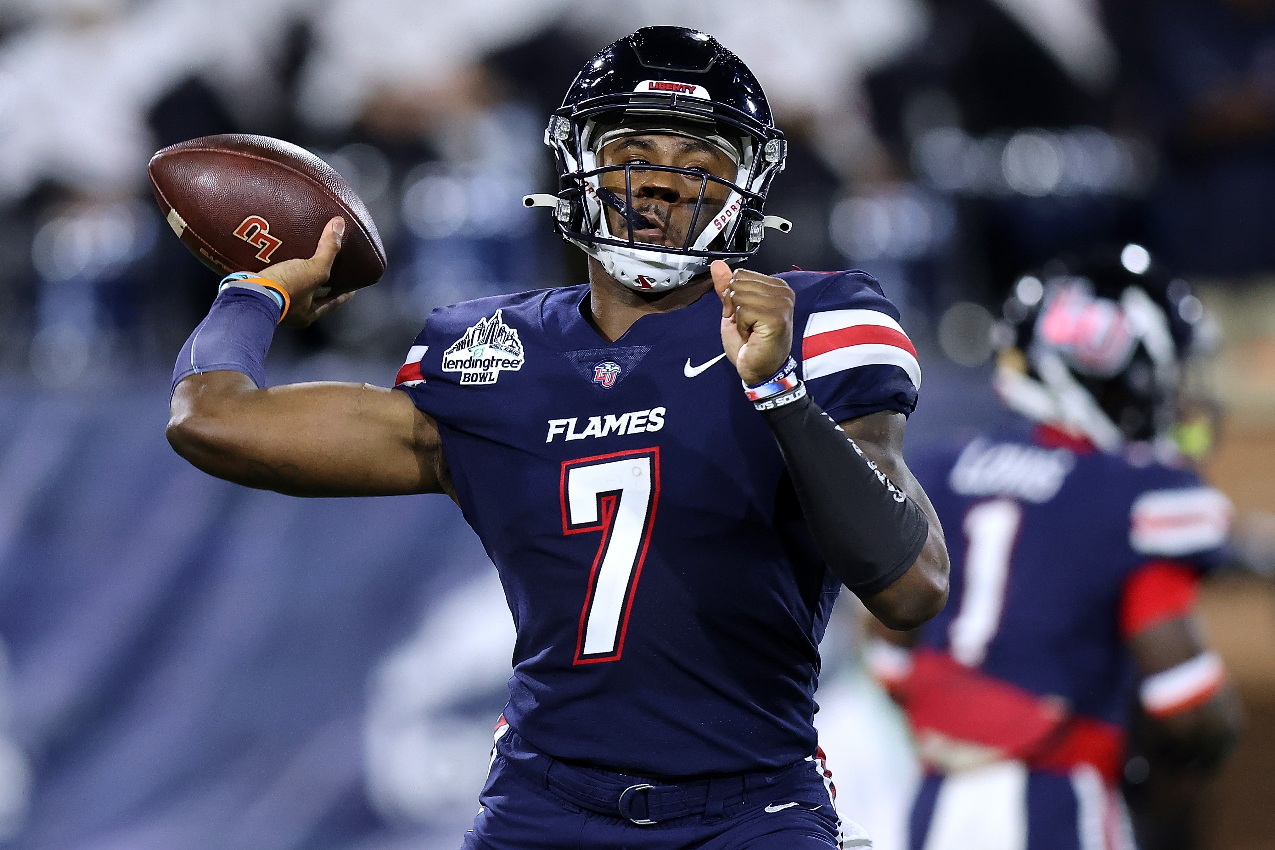 MOBILE, ALABAMA - DECEMBER 18: Malik Willis #7 of the Liberty Flames throws the the ball during the LendingTree Bowl at Hancock Whitney Stadium on December 18, 2021 in Mobile, Alabama. (Photo by Jonathan Bachman/Getty Images)