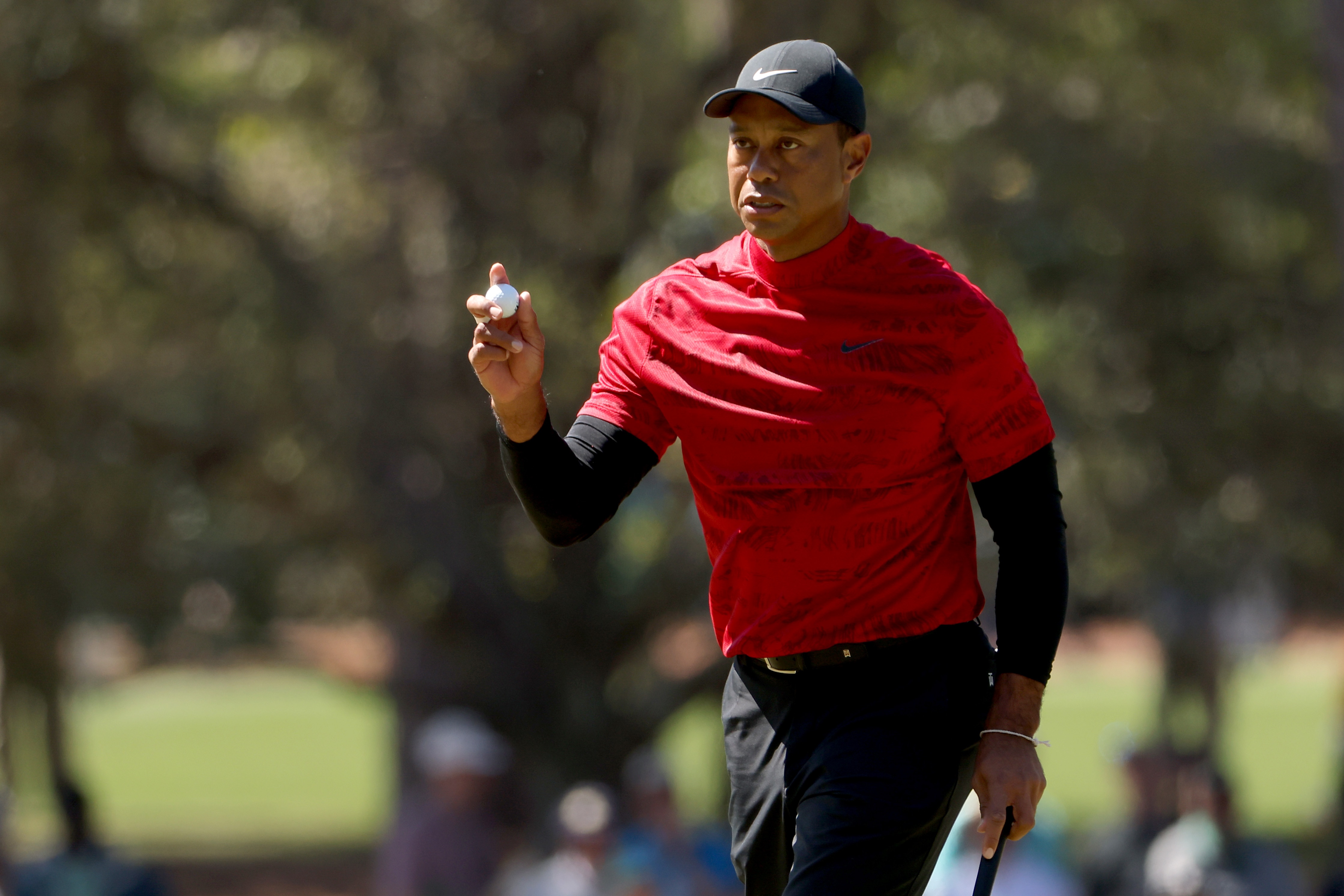 AUGUSTA, GEORGIA - APRIL 10: Tiger Woods reacts after making par on the third green during the final round of the Masters at Augusta National Golf Club on April 10, 2022 in Augusta, Georgia. (Photo by Jamie Squire/Getty Images)