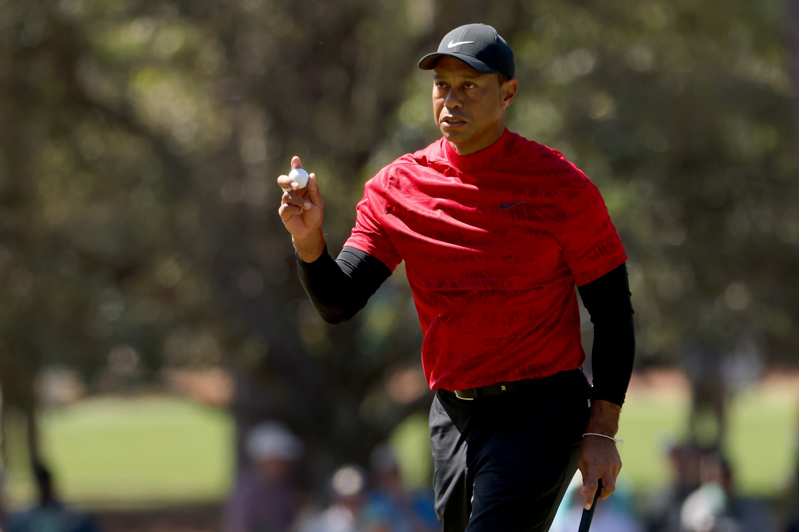 AUGUSTA, GEORGIA - APRIL 10: Tiger Woods reacts after making par on the third green during the final round of the Masters at Augusta National Golf Club on April 10, 2022 in Augusta, Georgia. (Photo by Jamie Squire/Getty Images)