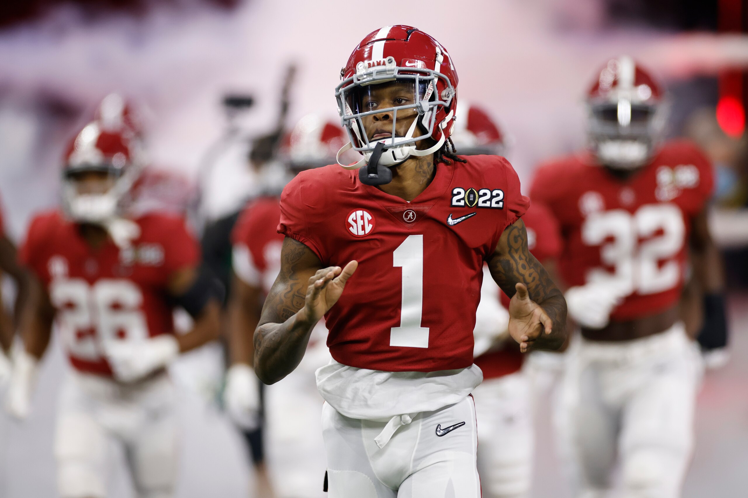 INDIANAPOLIS, IN - JANUARY 10: Alabama Crimson Tide wide receiver Jameson Williams (1) runs onto the field with his teammates prior to the CFP National Championship college football game against the Georgia Bulldogs on Jan. 10, 2022 at Lucas Oil Stadium in Indianapolis, Indiana. (Photo by Joe Robbins/Icon Sportswire via Getty Images)