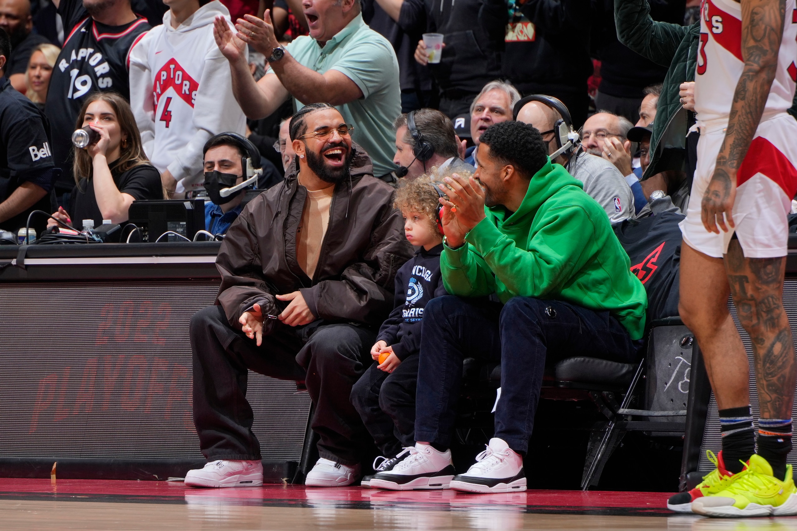 TORONTO, CANADA - APRIL 28: Rapper, Drake and Fuse News Host, Matte Babel, look on while attending the  Round 1 Game 5 of the 2022 NBA Playoffs between the Philadelphia 76ers and the Toronto Raptors on April 28, 2022 at the Scotiabank Arena in Toronto, Ontario, Canada.  NOTE TO USER: User expressly acknowledges and agrees that, by downloading and or using this Photograph, user is consenting to the terms and conditions of the Getty Images License Agreement.  Mandatory Copyright Notice: Copyright 2022 NBAE (Photo by Mark Blinch/NBAE via Getty Images)