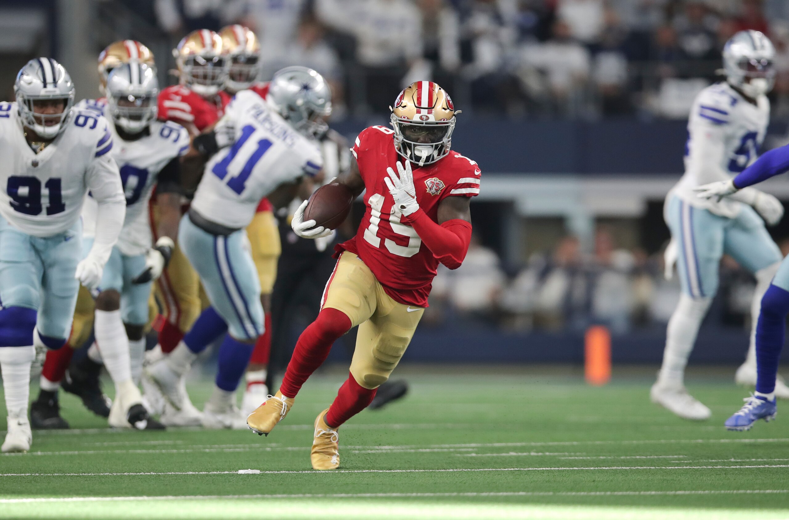 ARLINGTON, TX - JANUARY 16: Deebo Samuel #19 of the San Francisco 49ers runs after making a catch during the NFC Wild Card Playoff game against the Dallas Cowboys at AT&T Stadium on January 16, 2022 in Arlington, Texas. The 49ers defeated the Cowboys 23-17. (Photo by Michael Zagaris/San Francisco 49ers/Getty Images)