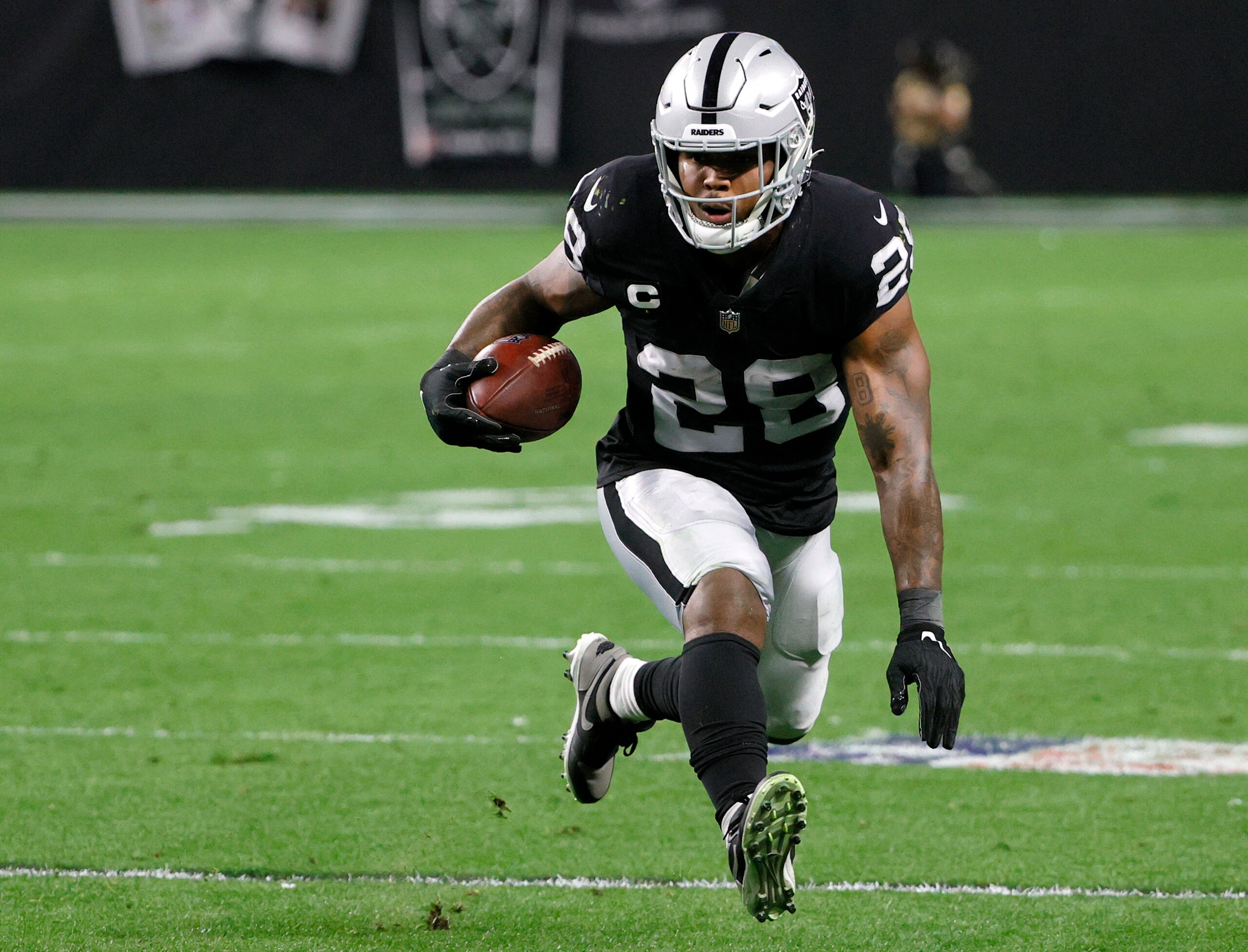 LAS VEGAS, NEVADA - JANUARY 09:  Running back Josh Jacobs #28 of the Las Vegas Raiders runs against the Los Angeles Chargers during their game at Allegiant Stadium on January 9, 2022 in Las Vegas, Nevada. The Raiders defeated the Chargers 35-32 in overtime.  (Photo by Ethan Miller/Getty Images)