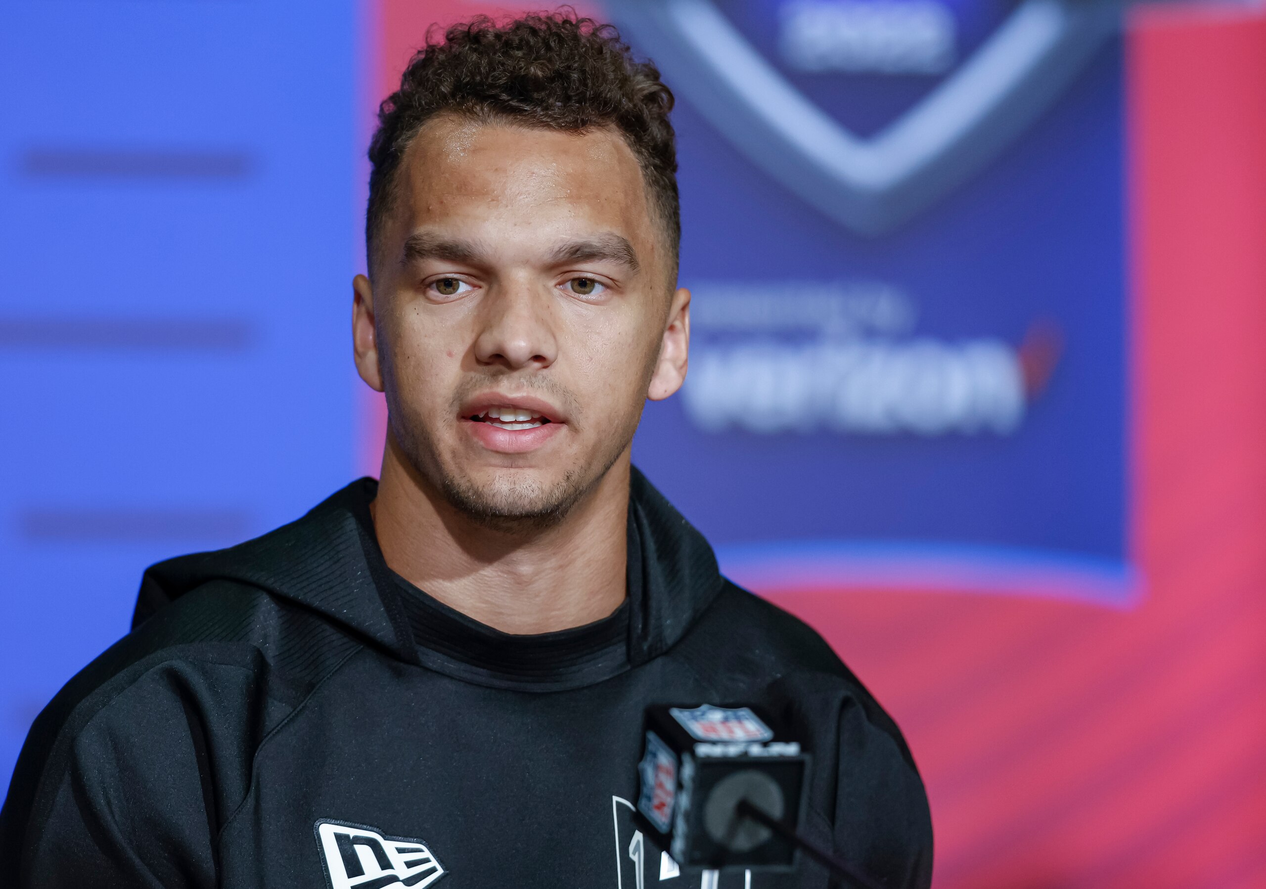 INDIANAPOLIS, IN - MAR 2: Desmond Ridder #QB13 of the Cincinnati Bearcats speaks to reporters during the NFL Draft Combine at the Indiana Convention Center on March 2, 2022 in Indianapolis, Indiana. (Photo by Michael Hickey/Getty Images)
