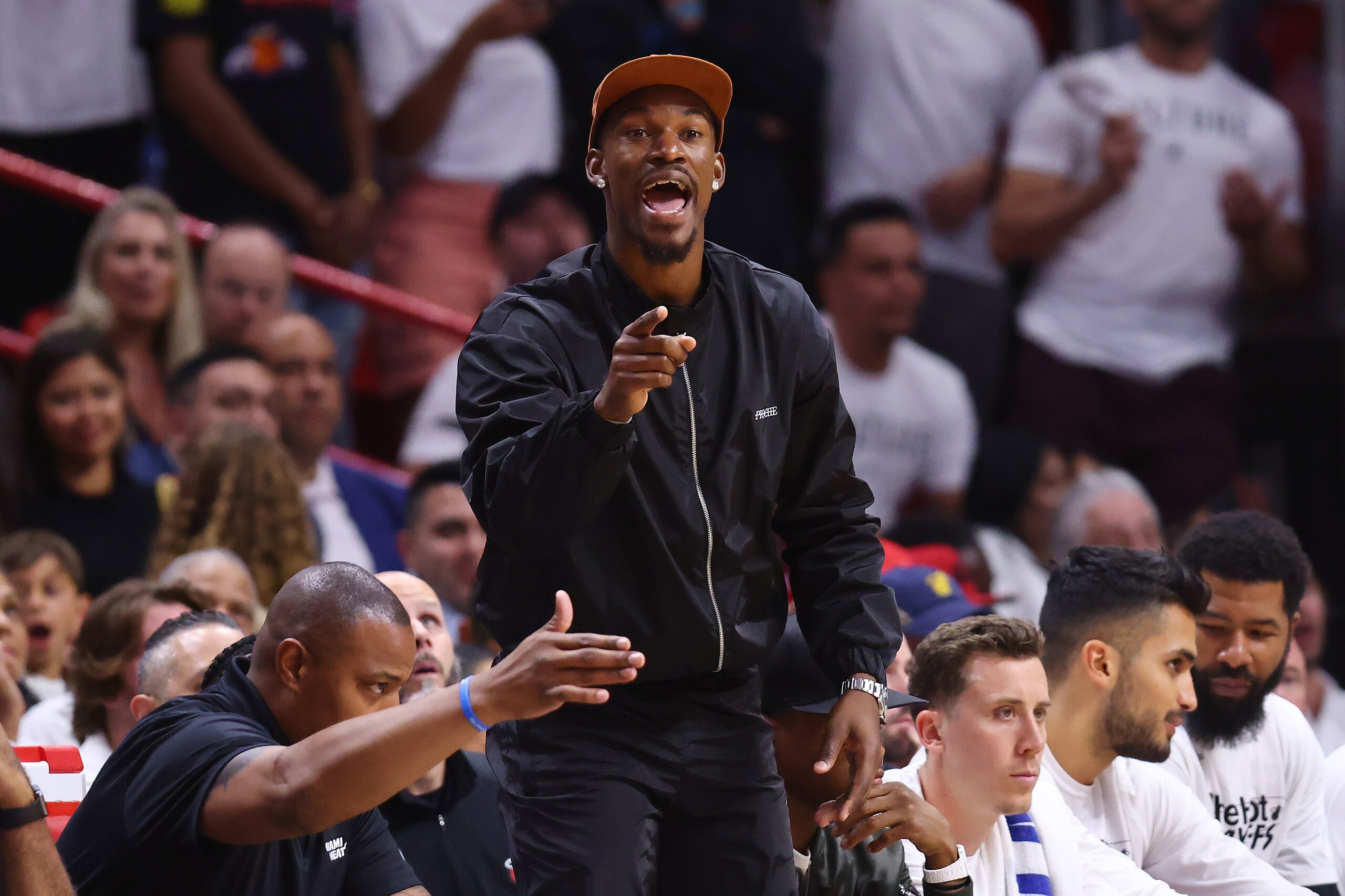 MIAMI, FLORIDA - APRIL 26: Jimmy Butler #22 of the Miami Heat reacts on the bench against the Atlanta Hawks during the first half in Game Five of the Eastern Conference First Round at FTX Arena on April 26, 2022 in Miami, Florida. NOTE TO USER: User expressly acknowledges and agrees that, by downloading and or using this photograph, User is consenting to the terms and conditions of the Getty Images License Agreement.  (Photo by Michael Reaves/Getty Images)