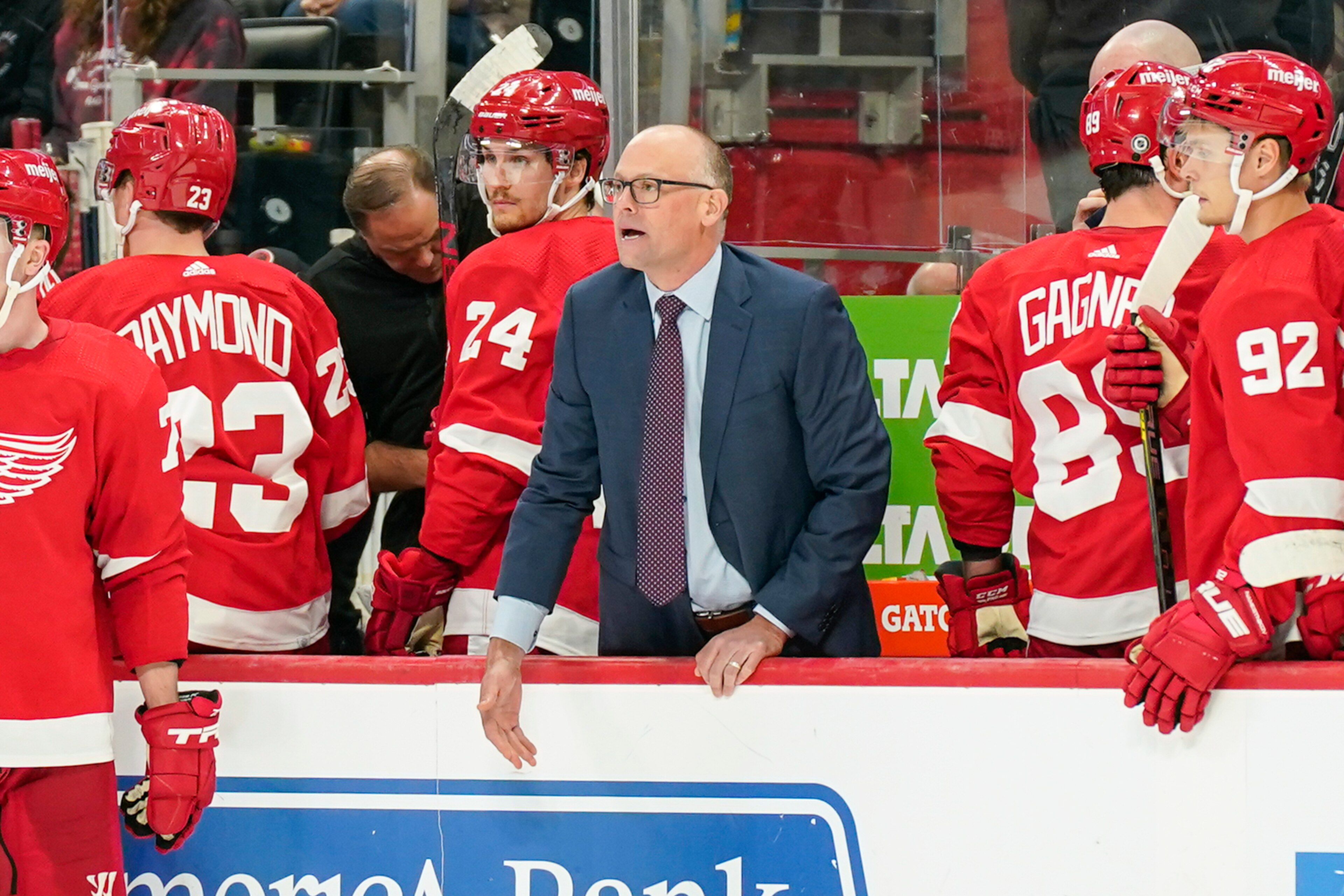 DETROIT, MI - OCTOBER 16: Detroit Red Wings head coach Jeff Blashill tries to get the attention of the referee during the third period of a game between the Detroit Red Wings and the Vancouver Canucks on October 16, 2021 at Little Caesars Arena in Detroit, MI. (Photo by Roy K. Miller/Icon Sportswire via Getty Images) DETROIT, MI - OCTOBER 16: Detroit Red Wings head coach Jeff Blashill tries to get the attention of the referee during the third period of a game between the Detroit Red Wings and the Vancouver Canucks on October 16, 2021 at Little Caesars Arena in Detroit, MI. (Photo by Roy K. Miller/Icon Sportswire via Getty Images)