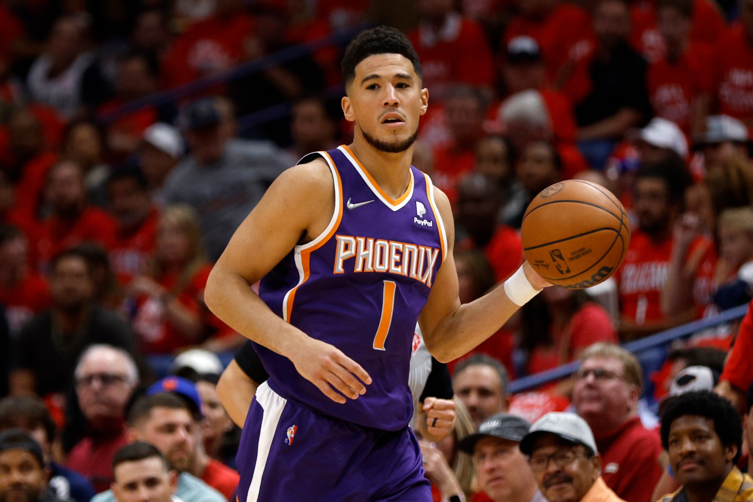 NEW ORLEANS, LOUISIANA - APRIL 28: Devin Booker #1 of the Phoenix Suns drives the ball up the court against the New Orleans Pelicans at Smoothie King Center on April 28, 2022 in New Orleans, Louisiana.  NOTE TO USER: User expressly acknowledges and agrees that, by downloading and or using this Photograph, user is consenting to the terms and conditions of the Getty Images License Agreement.  (Photo by Chris Graythen/Getty Images)
