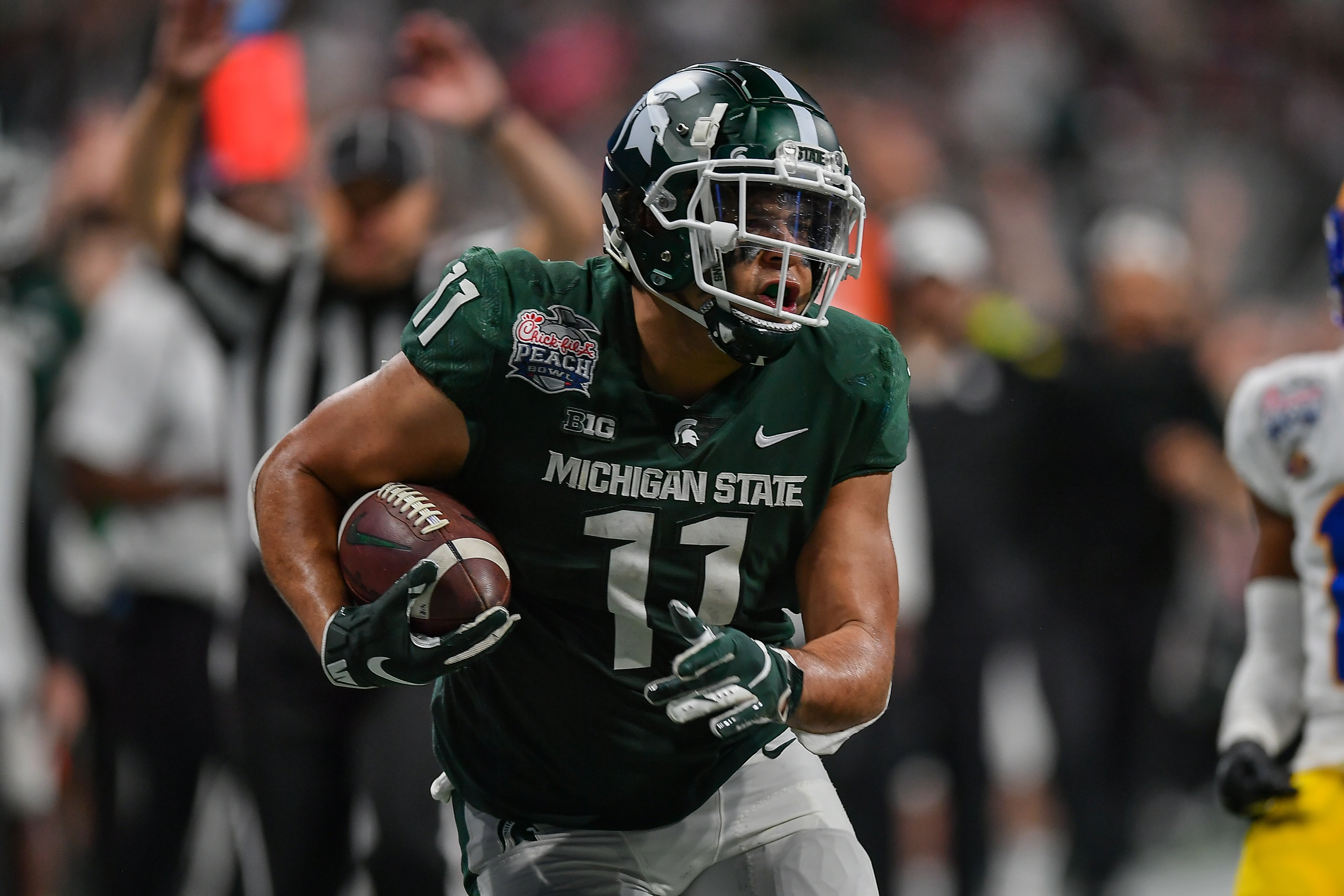 ATLANTA, GA  DECEMBER 30:  Michigan State tight end Connor Heyward (11) runs with the ball during the Chick-fil-A Peach Bowl between the Michigan State Spartans and Pittsburgh Panthers on December 30th, 2021 at Mercedes Benz Stadium in Atlanta, GA.  (Photo by Rich von Biberstein/Icon Sportswire via Getty Images)